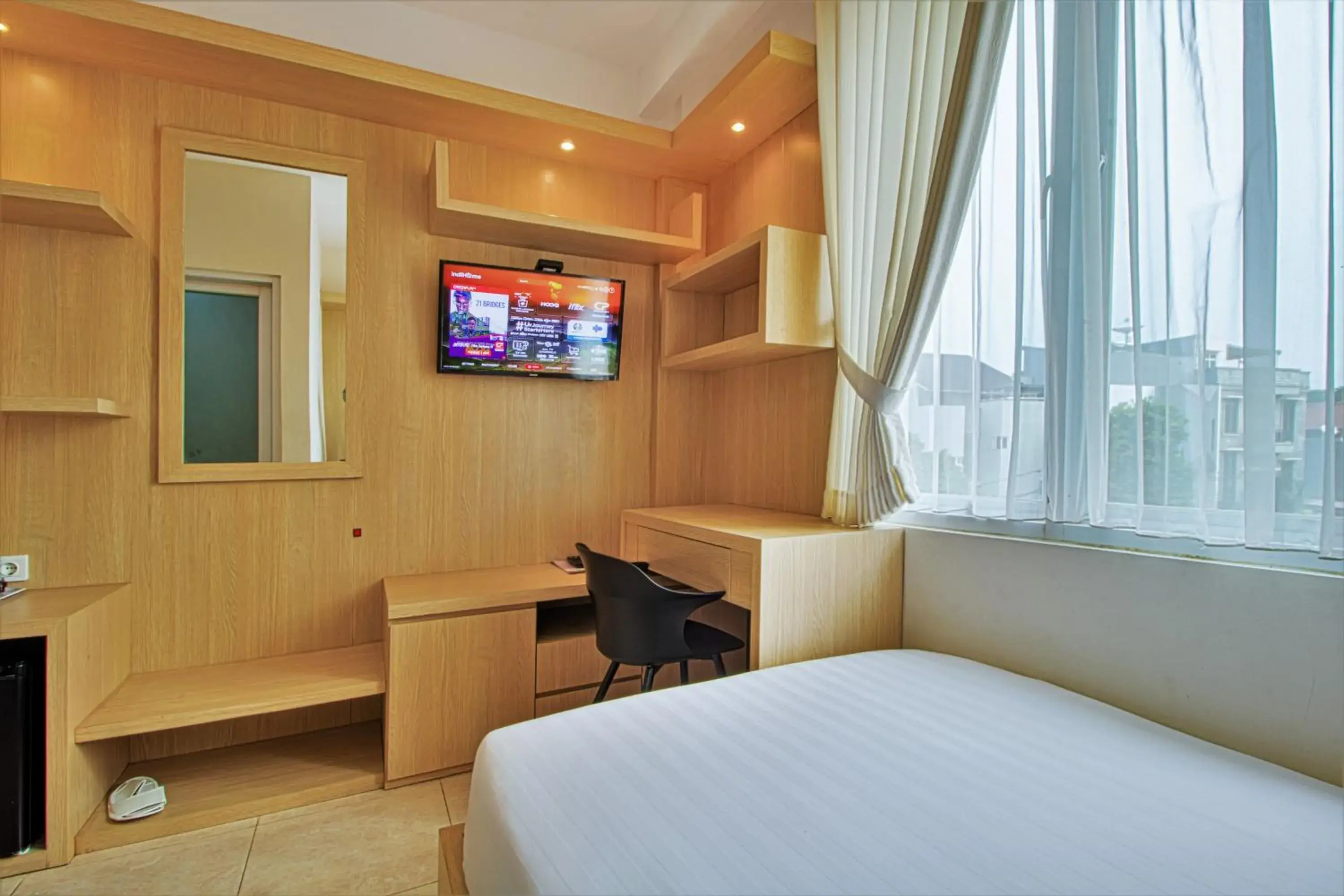 Bed, TV/Entertainment Center in D Padmaya Residence