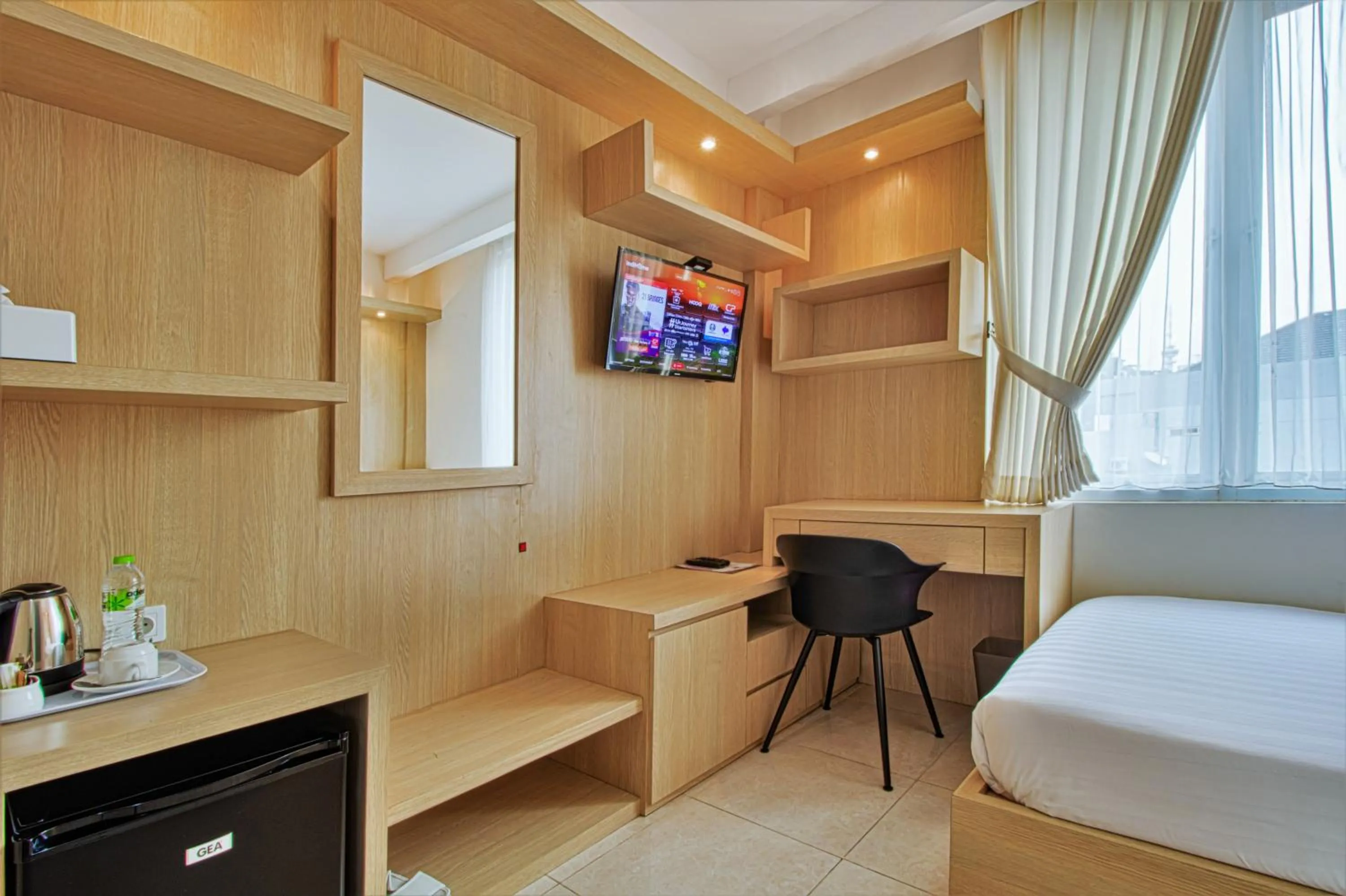 Bed, TV/Entertainment Center in D Padmaya Residence