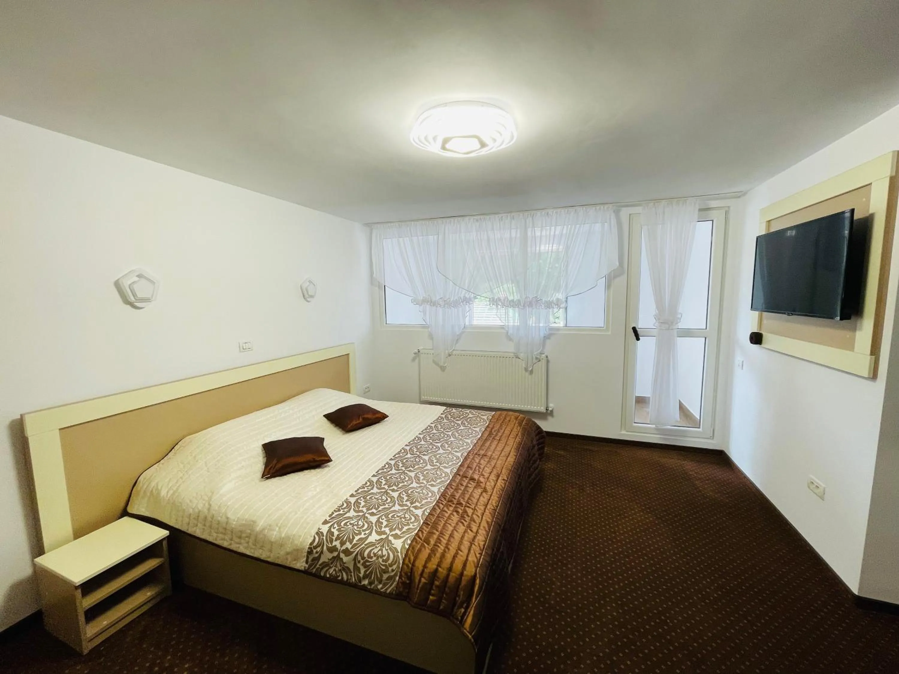 Bed in Pensiunea Sport