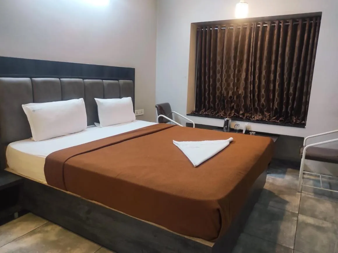 Bed in Hotel Vrindavan Deluxe Kolhapur NEAR CENTRAL BUS STAND