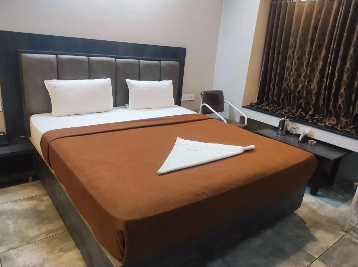 Bed in Hotel Vrindavan Deluxe Kolhapur NEAR CENTRAL BUS STAND