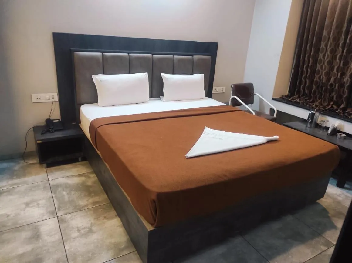 Bedroom in Hotel Vrindavan Deluxe Kolhapur NEAR CENTRAL BUS STAND