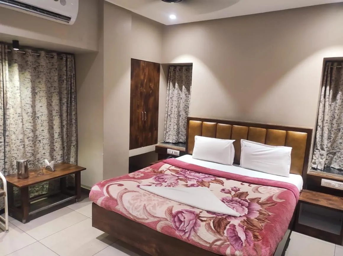 Bed in Hotel Vrindavan Deluxe Kolhapur NEAR CENTRAL BUS STAND