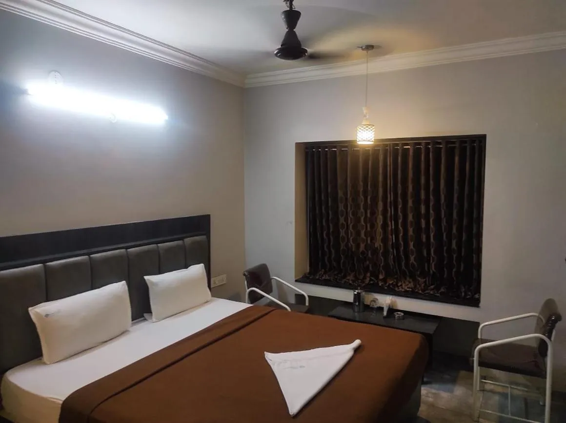 Bed in Hotel Vrindavan Deluxe Kolhapur NEAR CENTRAL BUS STAND