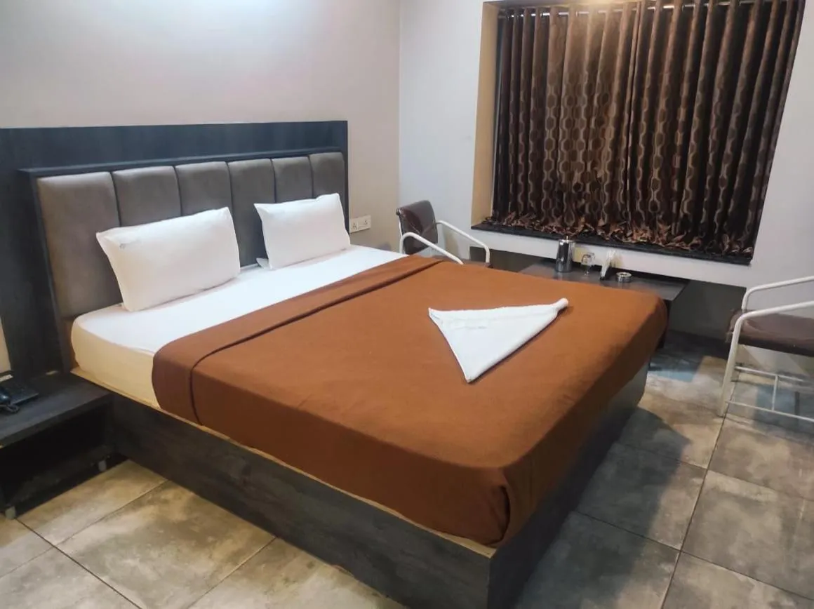 Bed in Hotel Vrindavan Deluxe Kolhapur NEAR CENTRAL BUS STAND