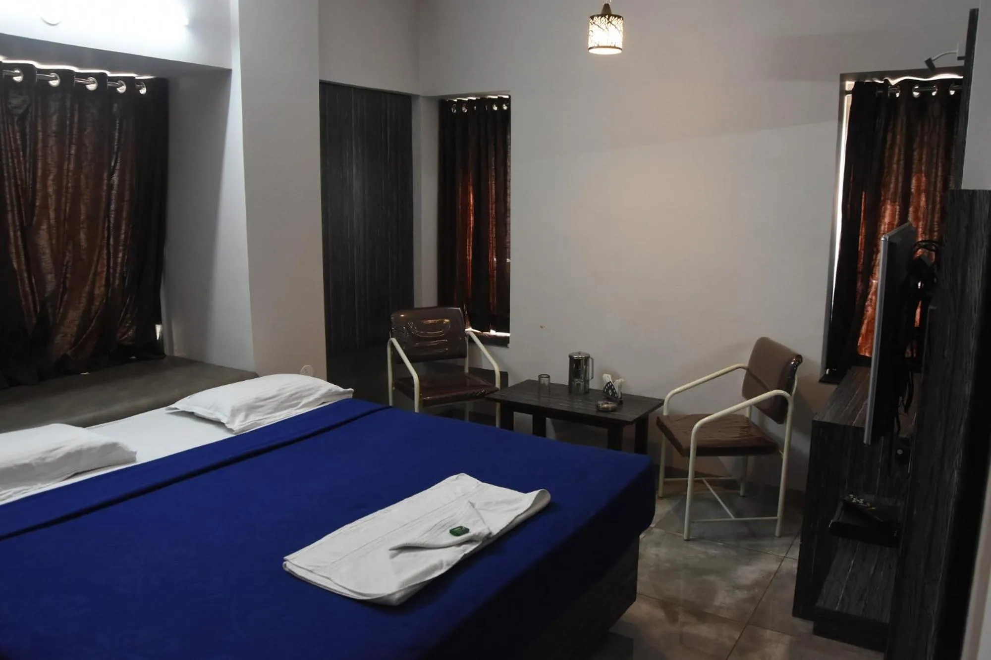 Bed in Hotel Vrindavan Deluxe Kolhapur NEAR CENTRAL BUS STAND