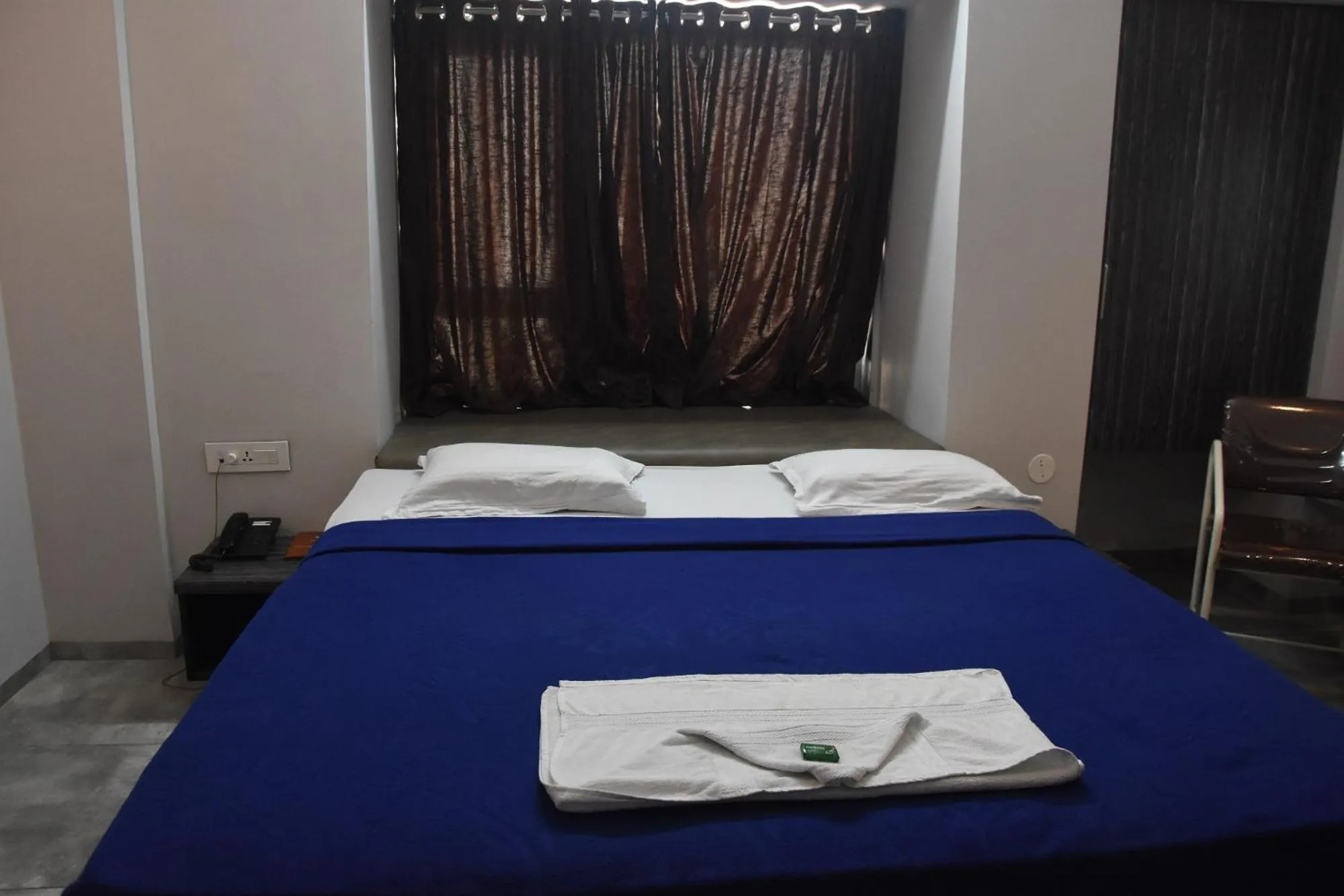 Bed in Hotel Vrindavan Deluxe Kolhapur NEAR CENTRAL BUS STAND