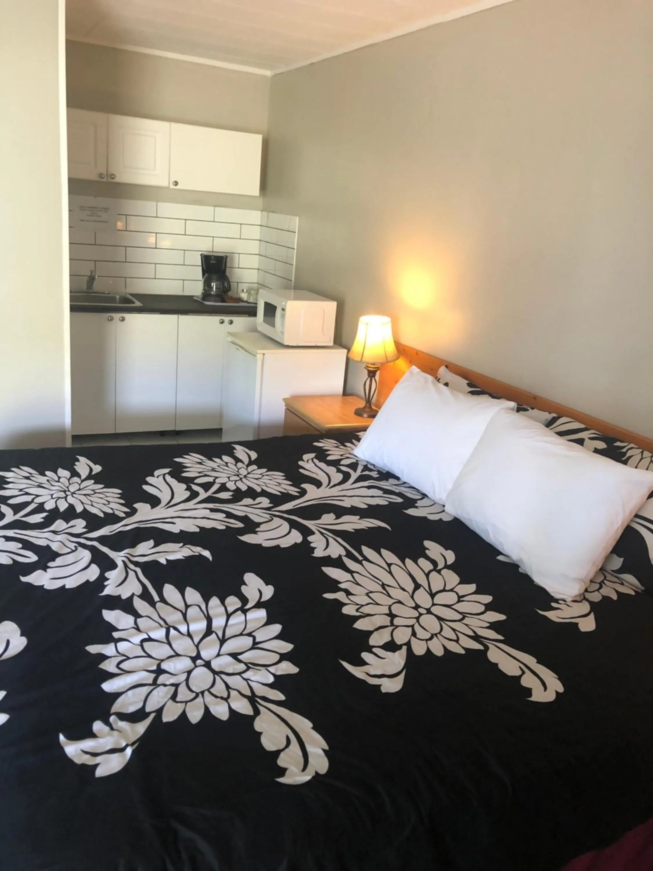 Bed in Sage Hills Motel