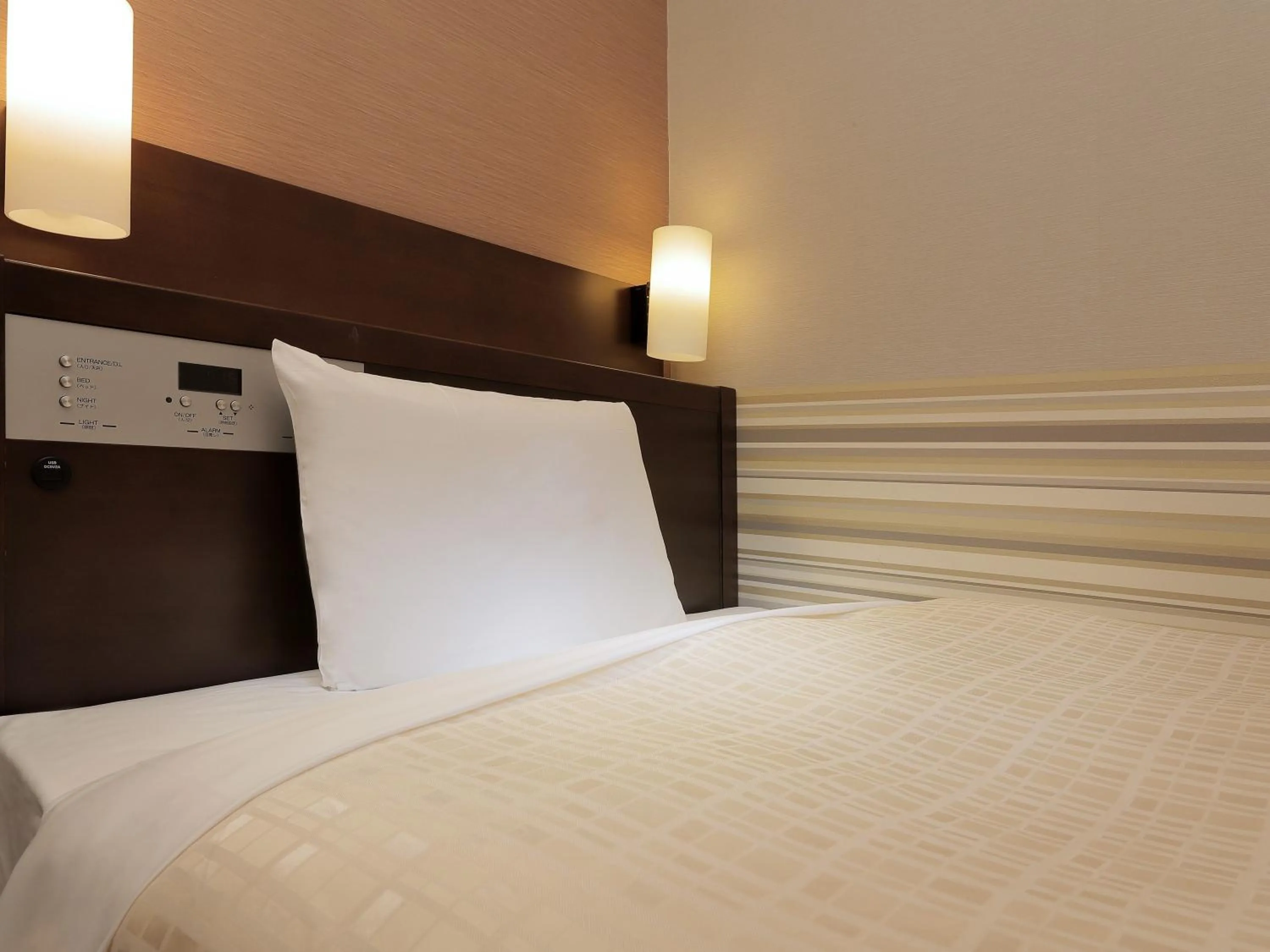 Bed in Keio Presso Inn Kanda