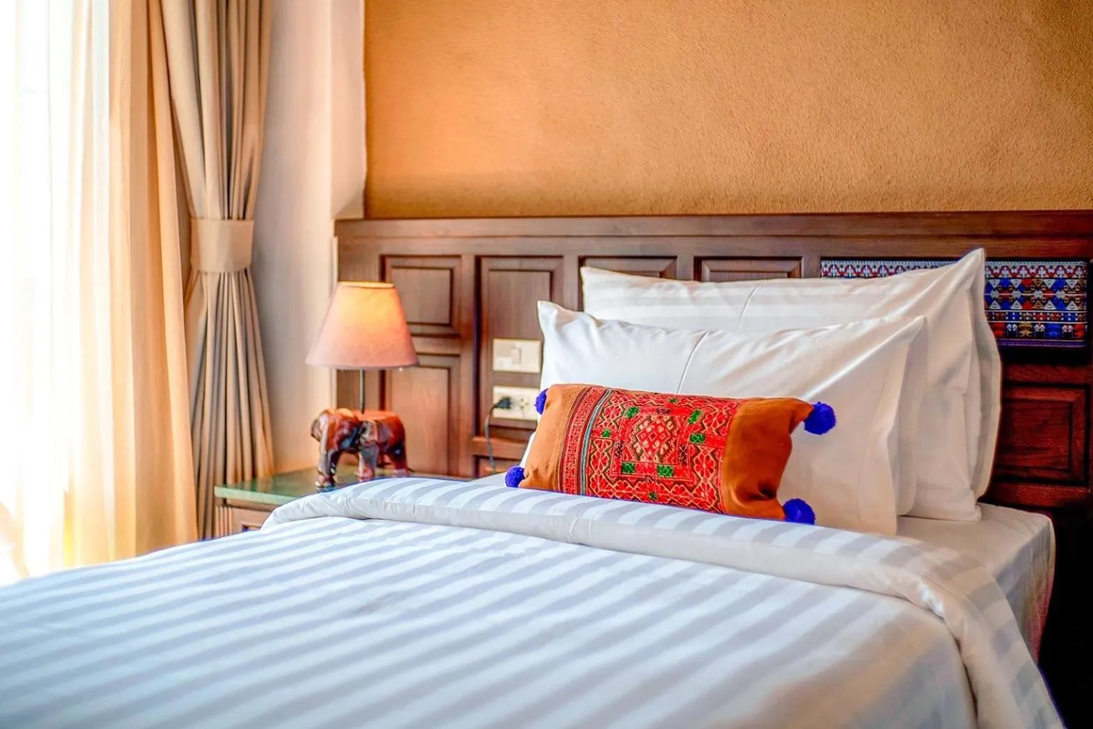 Bed in Smile Lanna Hotel