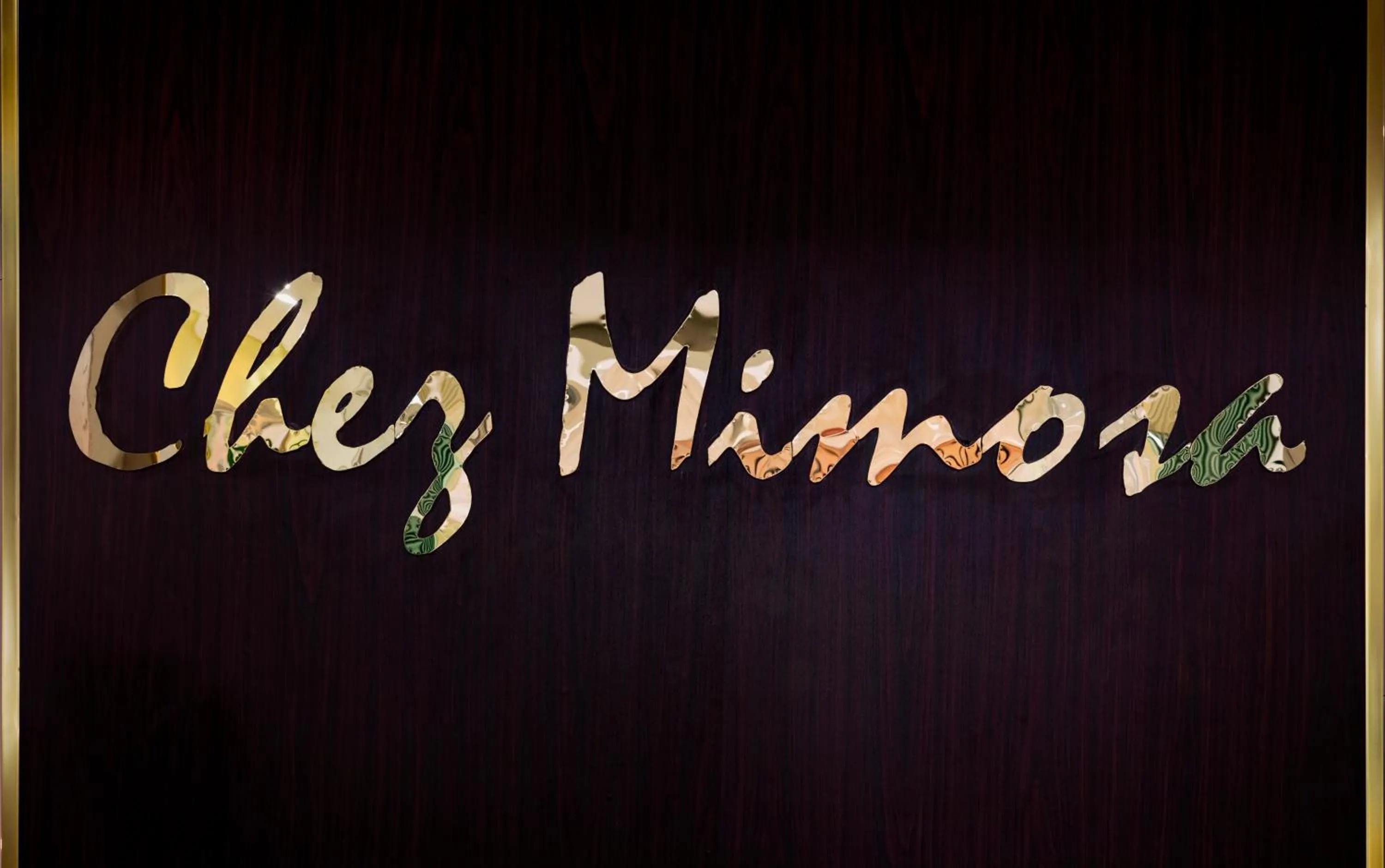 Property logo or sign in Chez Mimosa Petite - Free Laundry