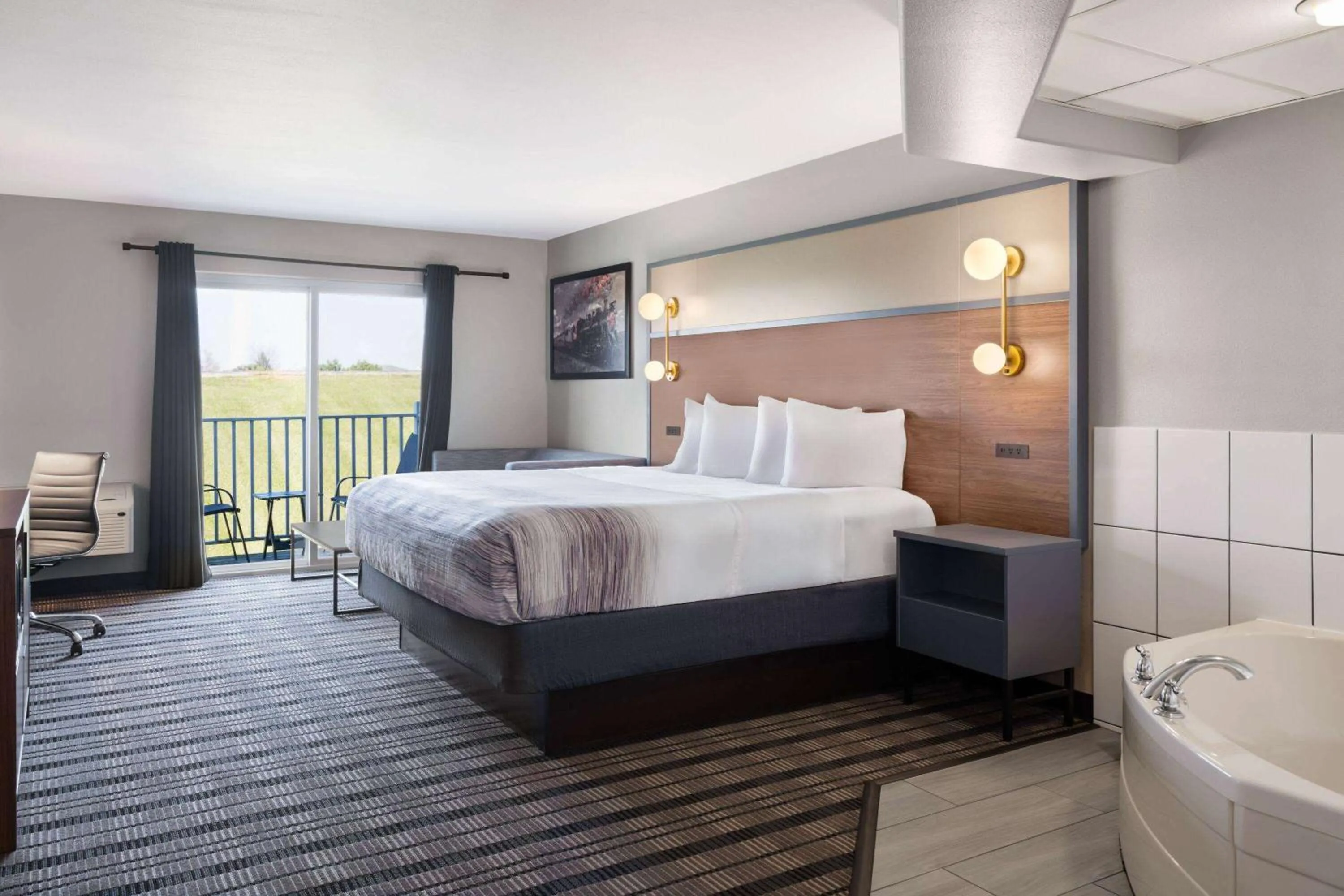 Bath, Bed in AmericInn by Wyndham Beaver Dam