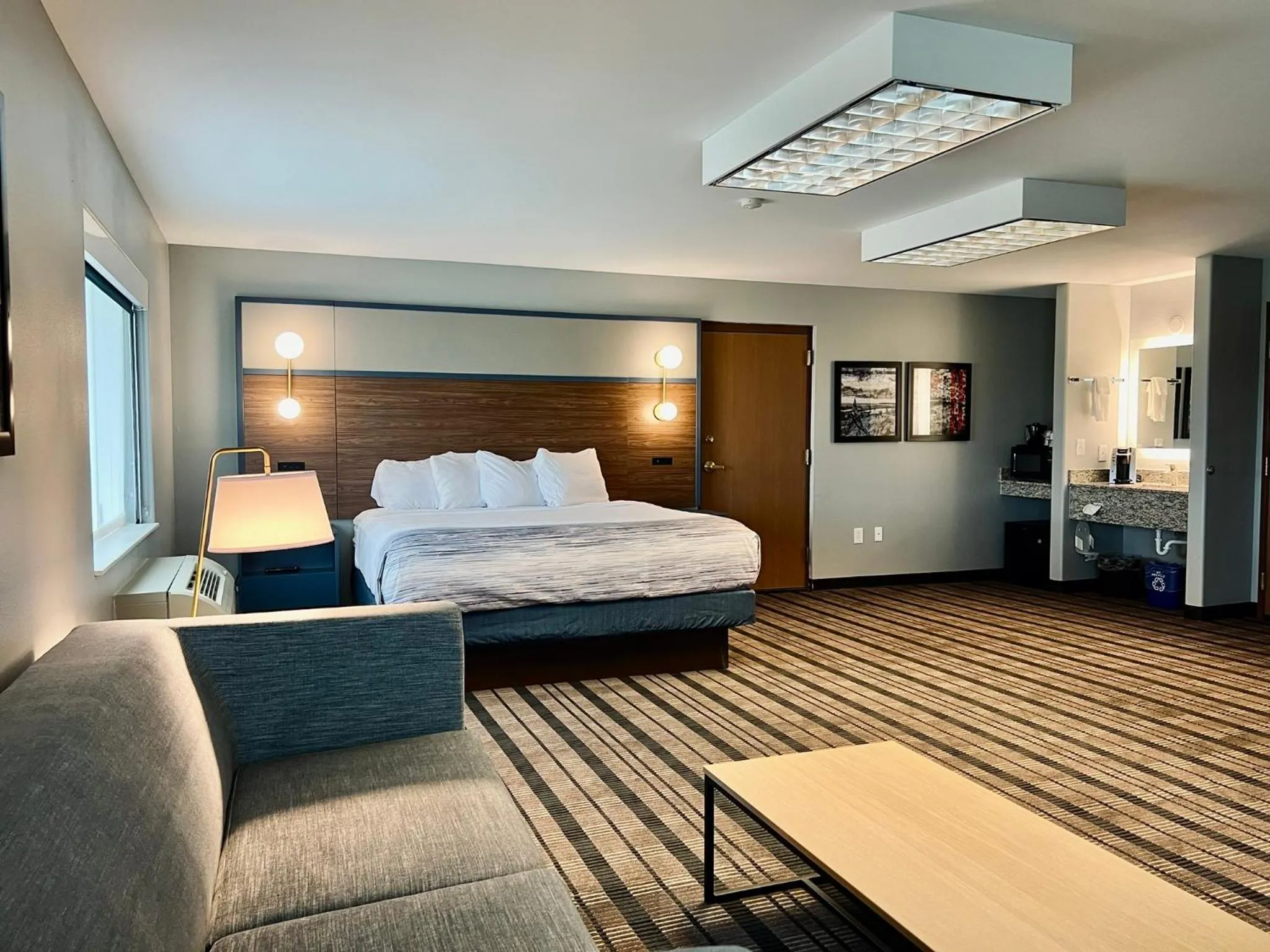 Bed in AmericInn by Wyndham Beaver Dam