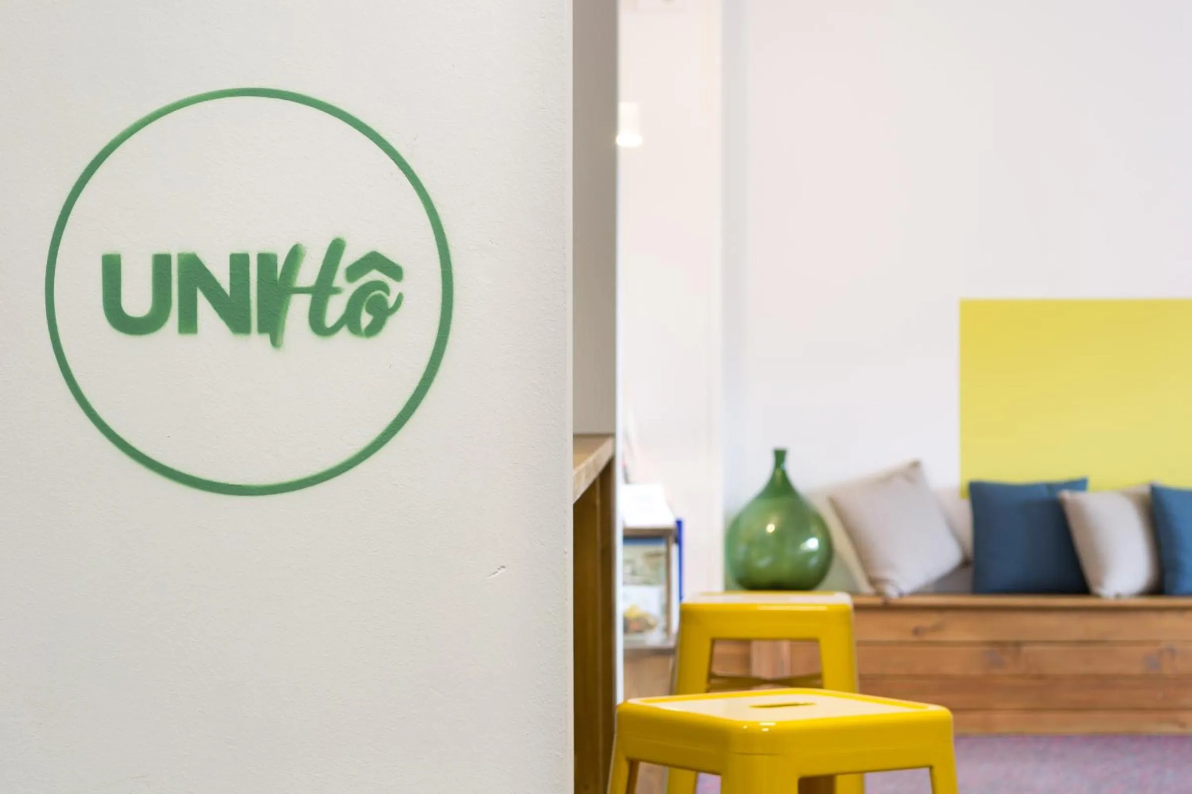 Communal lounge/ TV room in UniHo Hostel