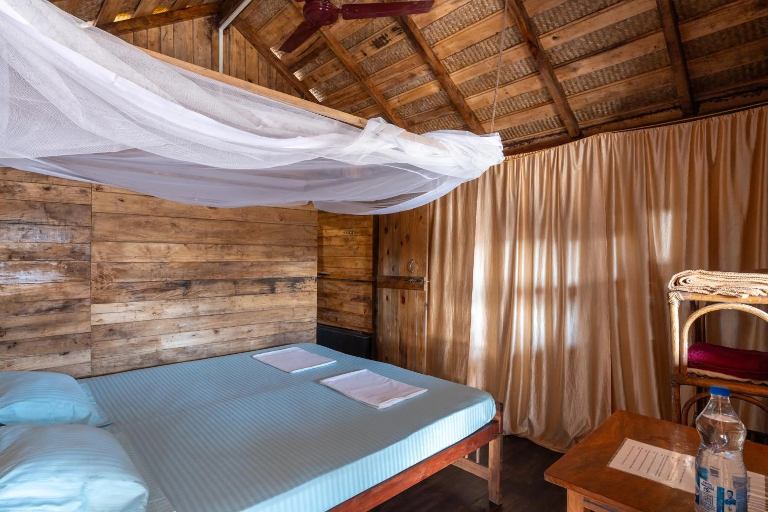 Bed in Blue Corner Beach Huts & Restaurant