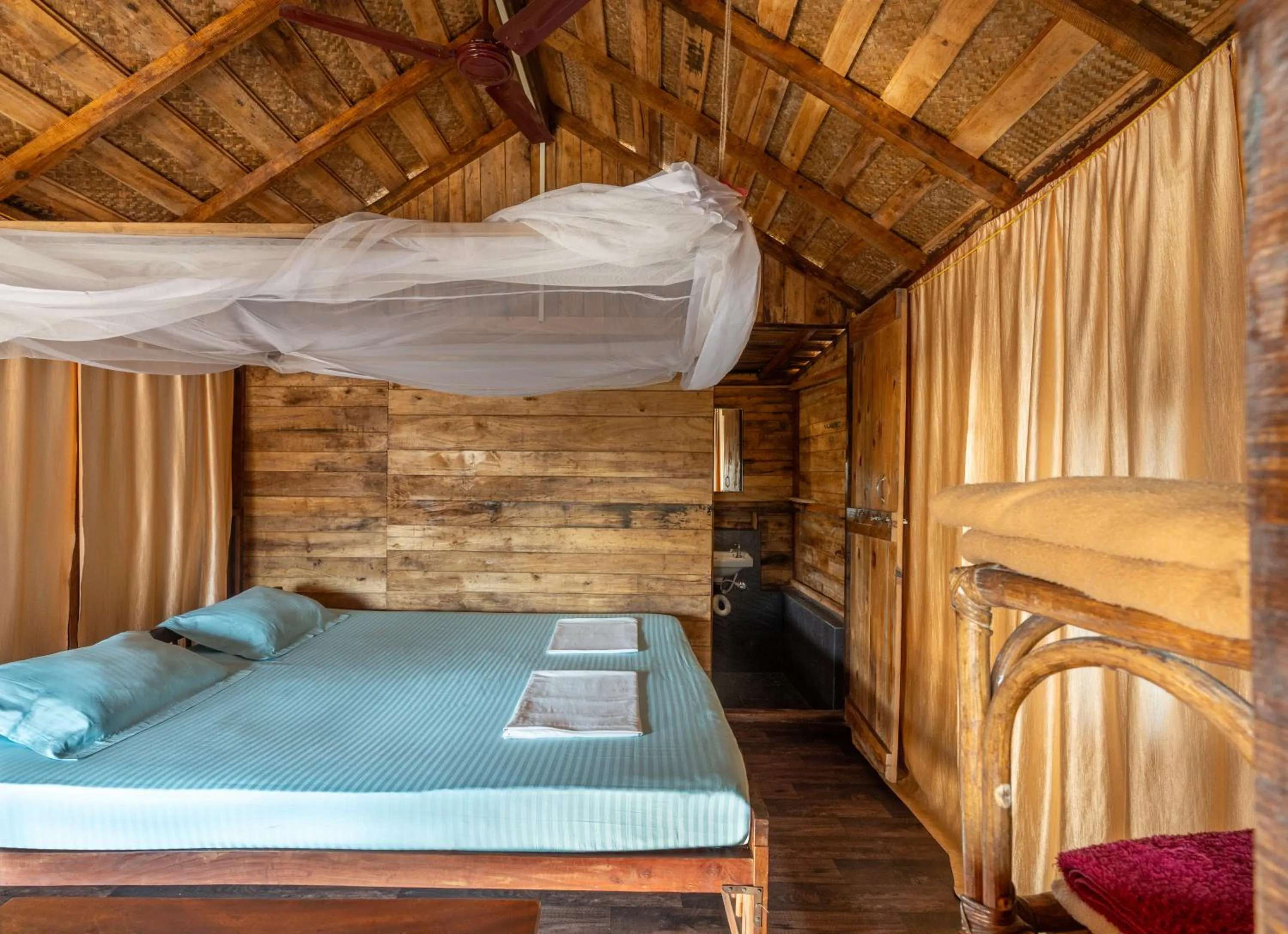 Bed in Blue Corner Beach Huts & Restaurant