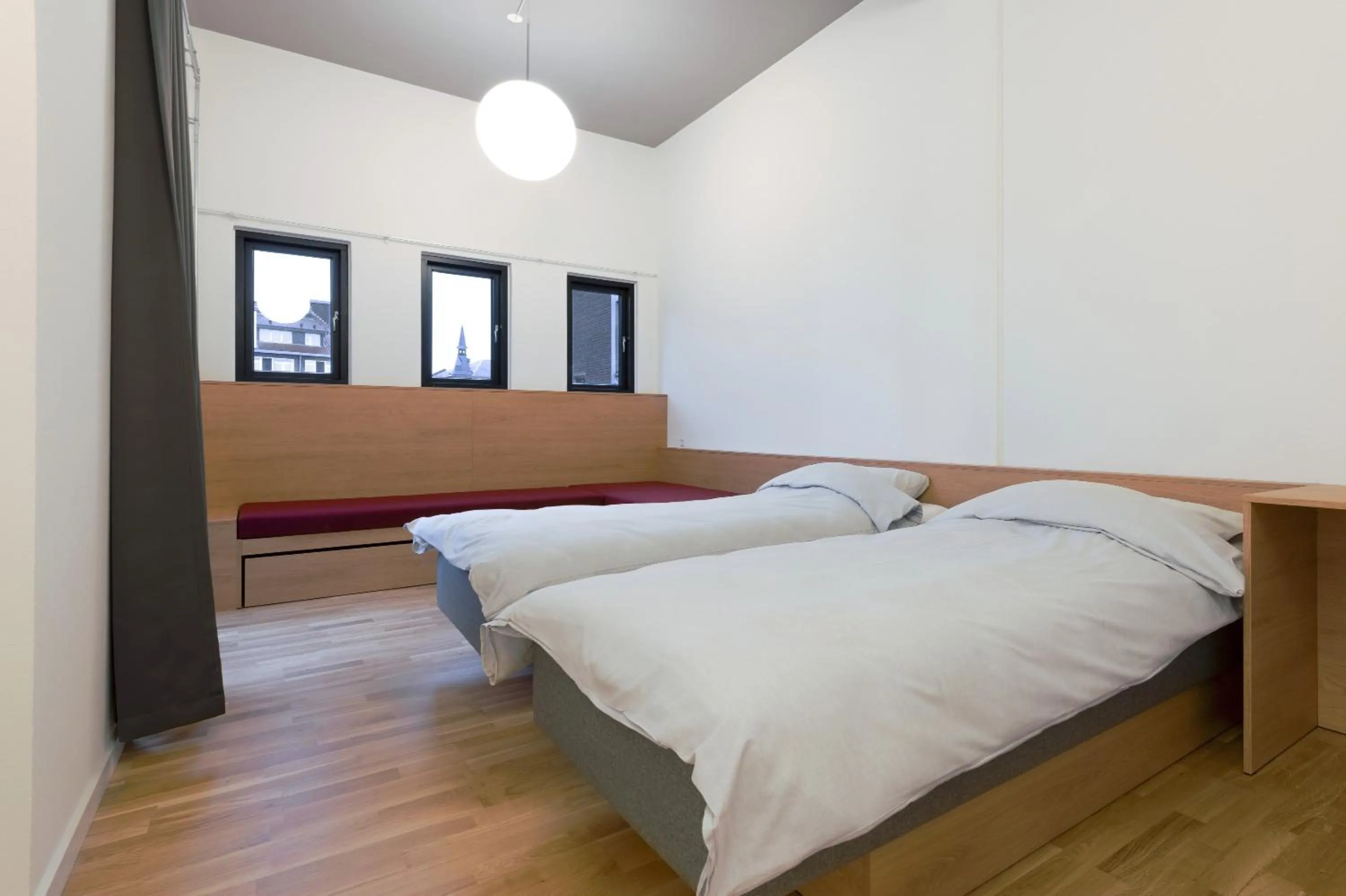 Bed in BOOK1 by Brøchner Hotels