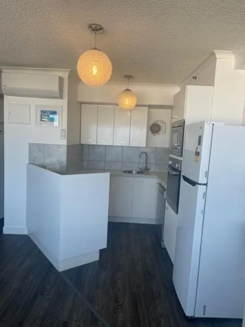 Kitchen or kitchenette in Centrepoint Apartments Caloundra