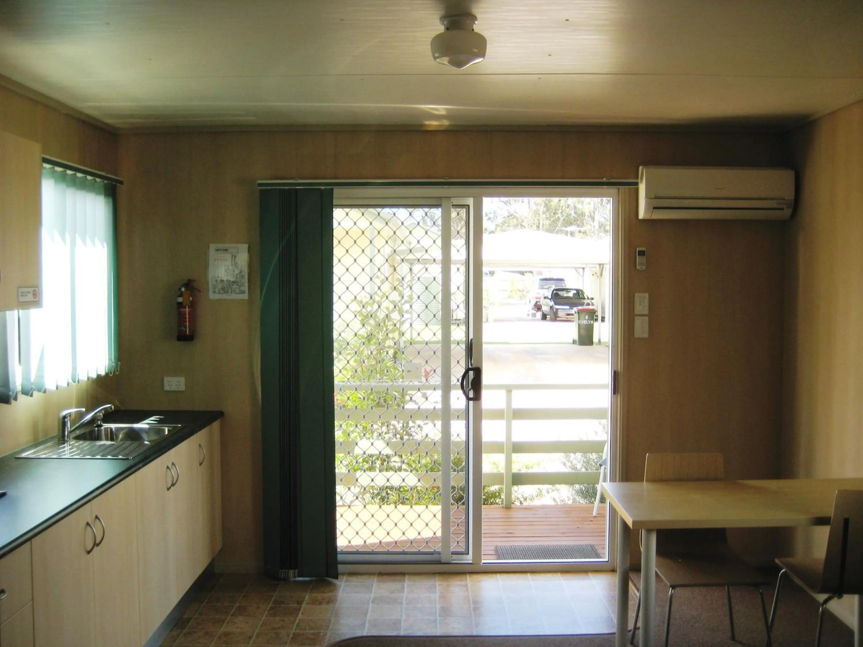 Kitchen or kitchenette in PepperTree Cabins, Kingaroy