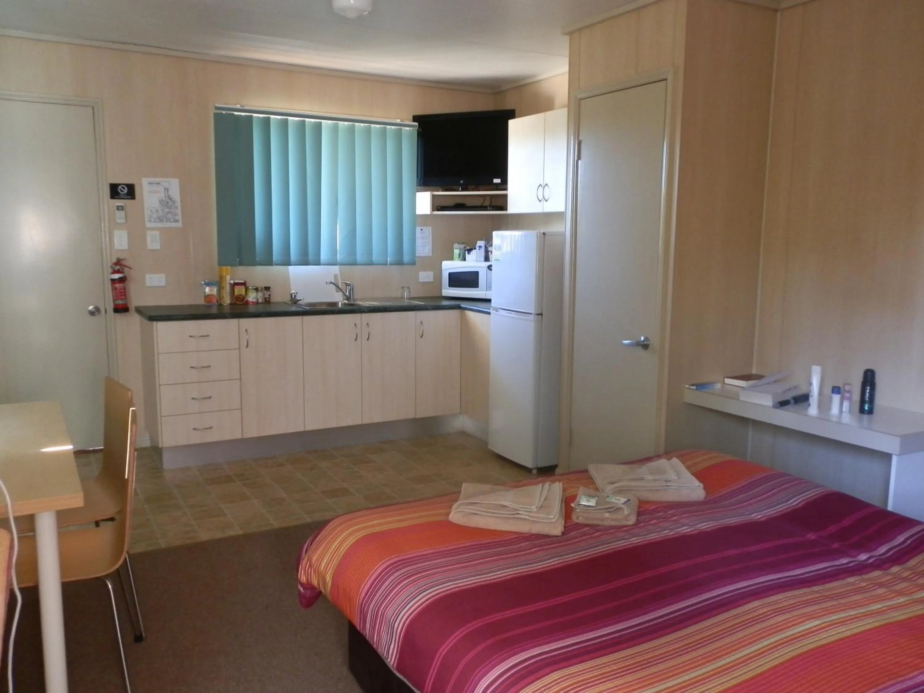 Bed in PepperTree Cabins, Kingaroy