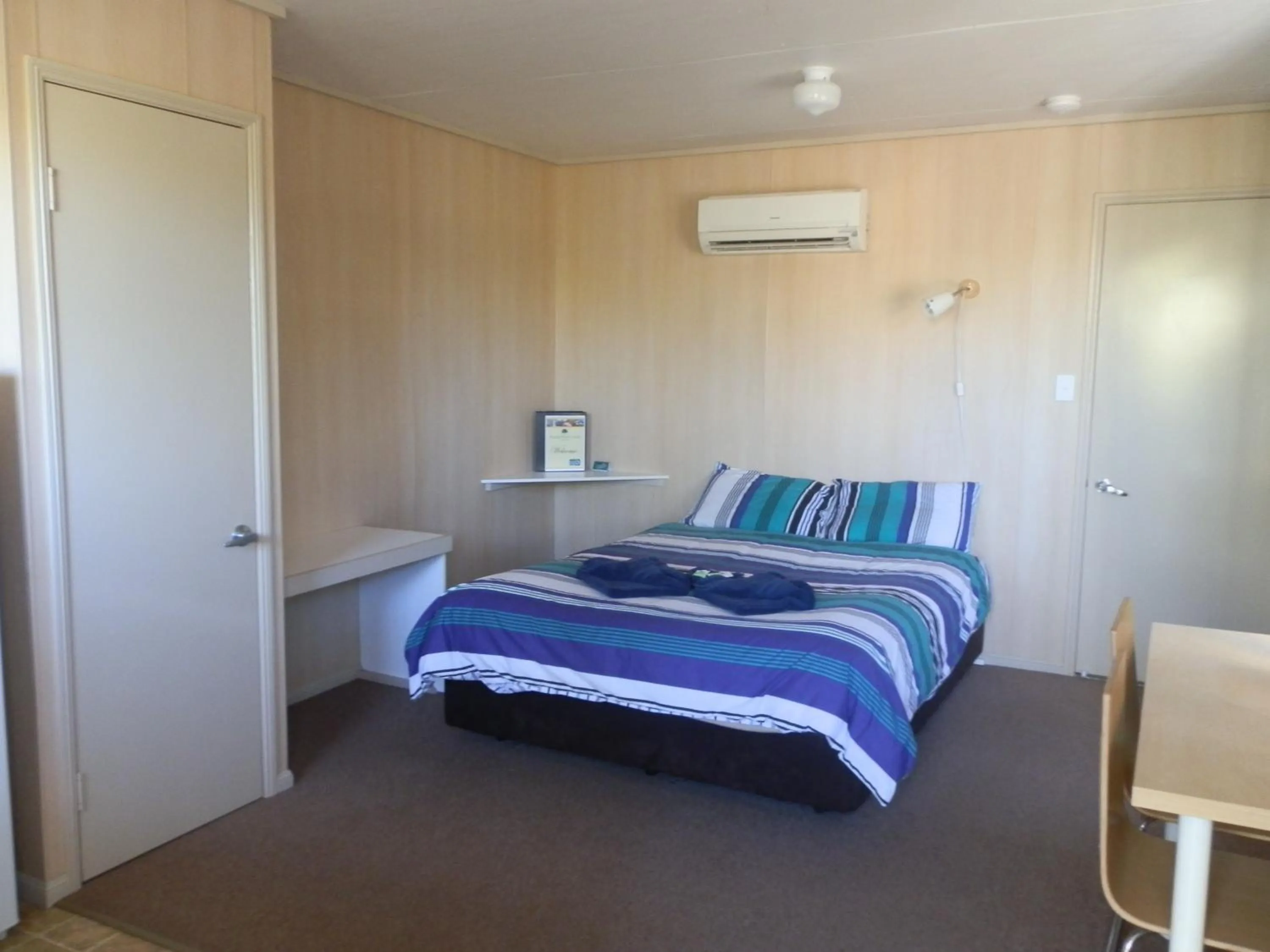 Bed in PepperTree Cabins, Kingaroy
