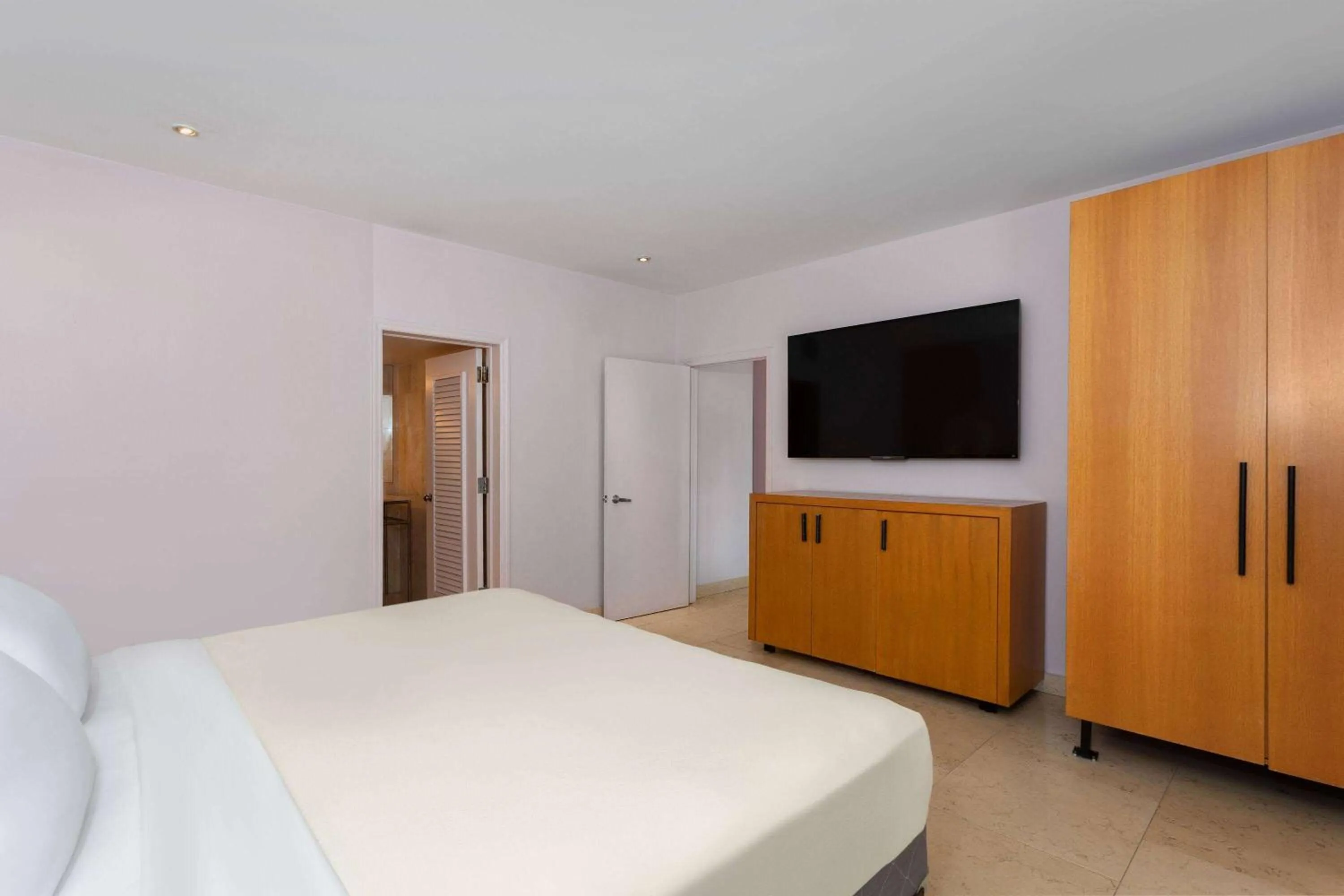 Bed, TV/Entertainment Center in The Astor by LuxUrban