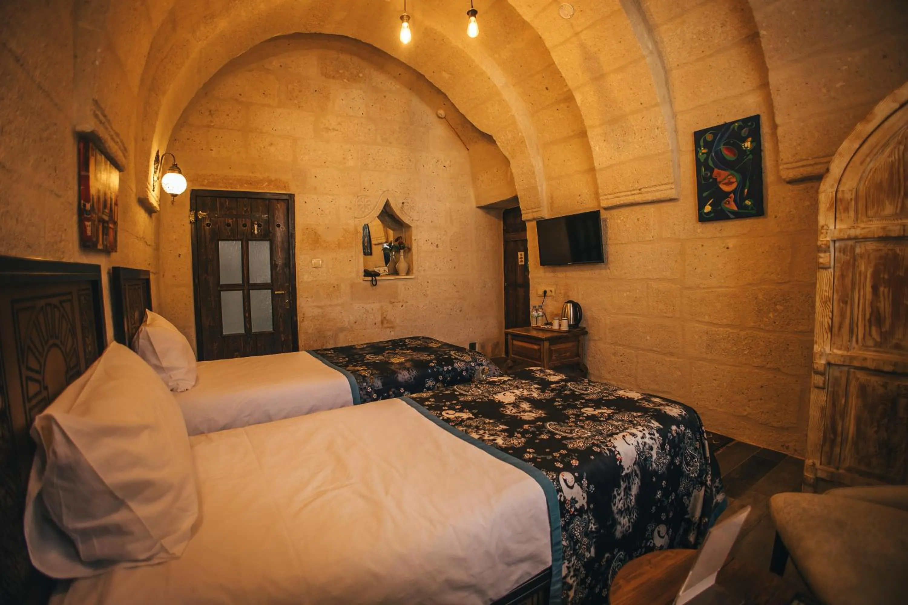 Bed in Vintage Cave House Hotel