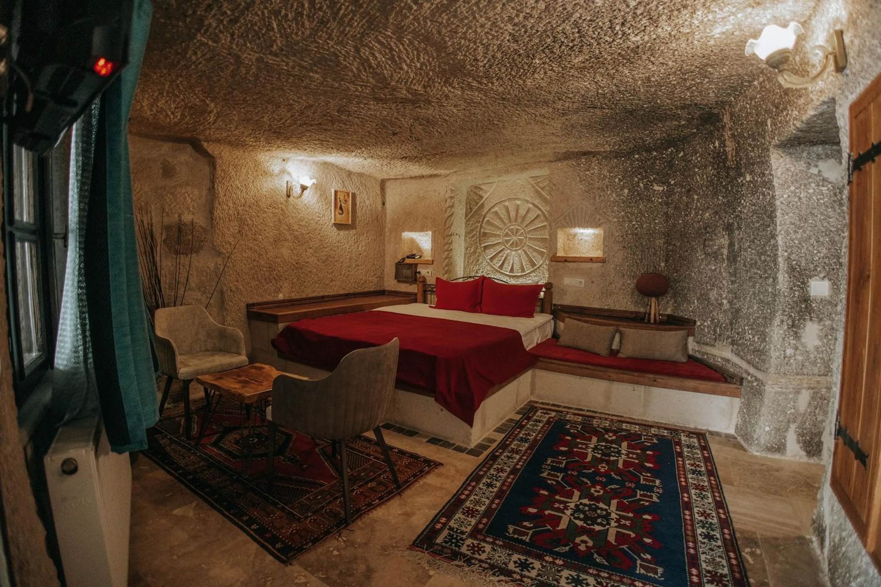 Bed in Vintage Cave House Hotel