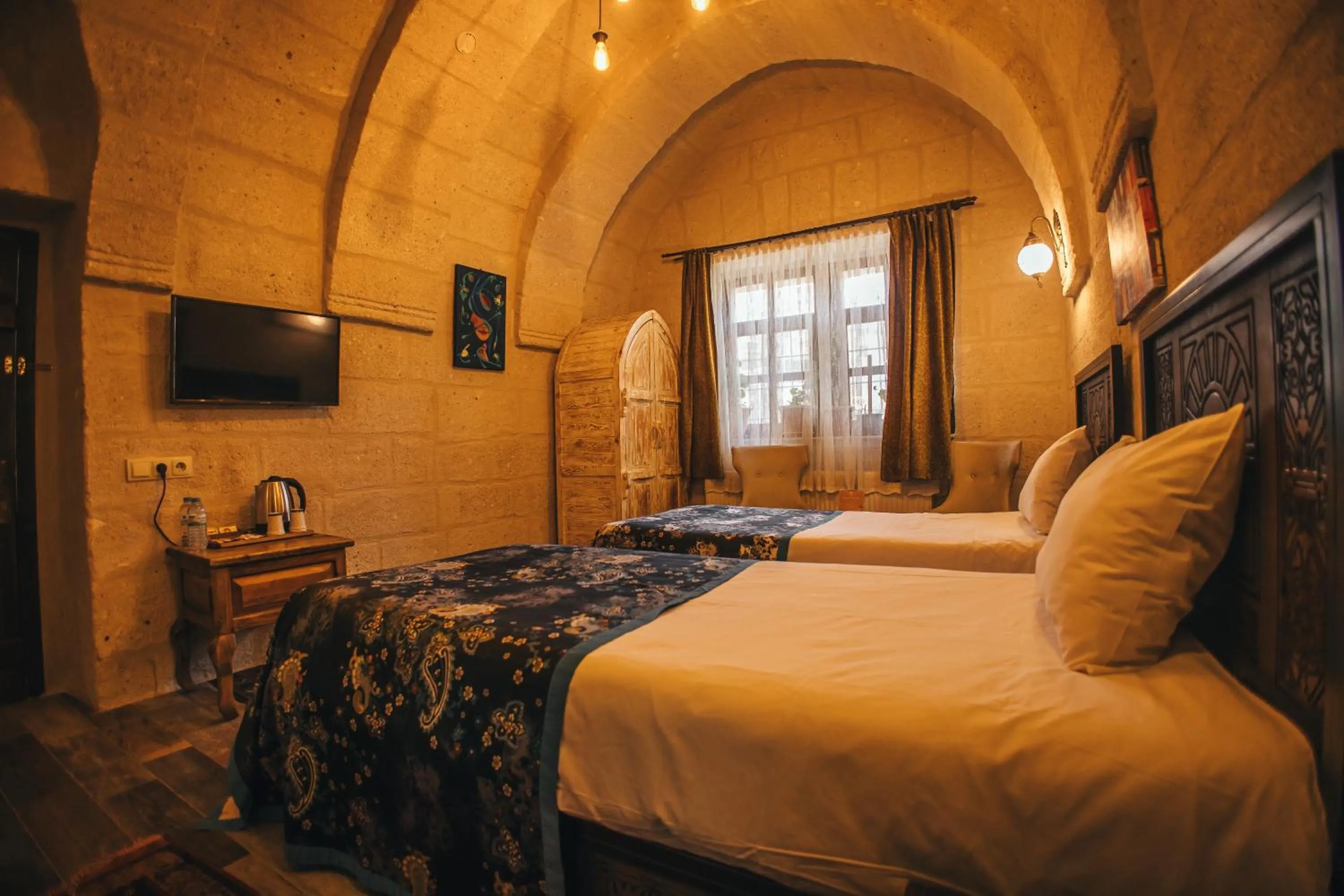 Bed in Vintage Cave House Hotel