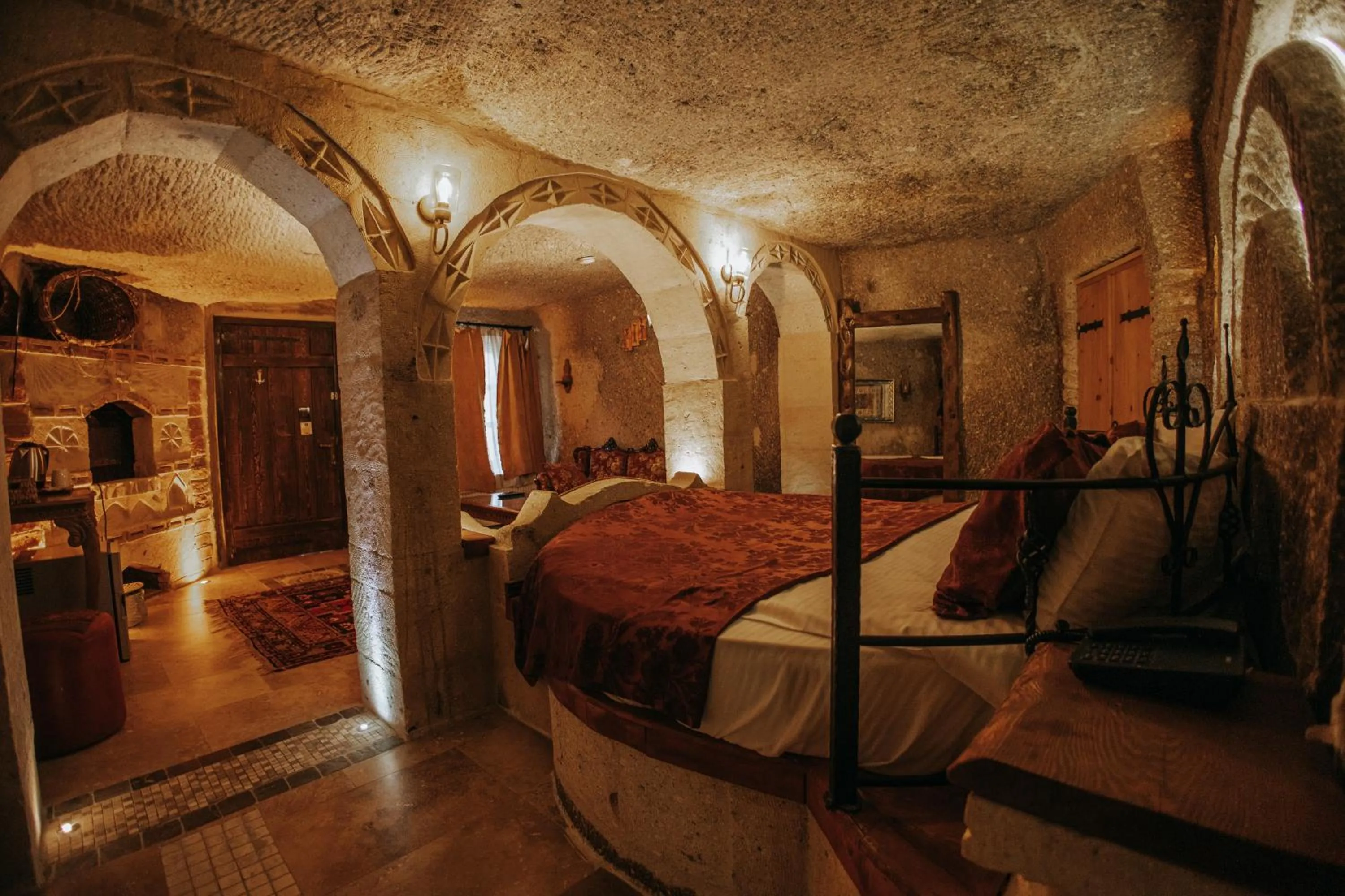 Bed in Vintage Cave House Hotel