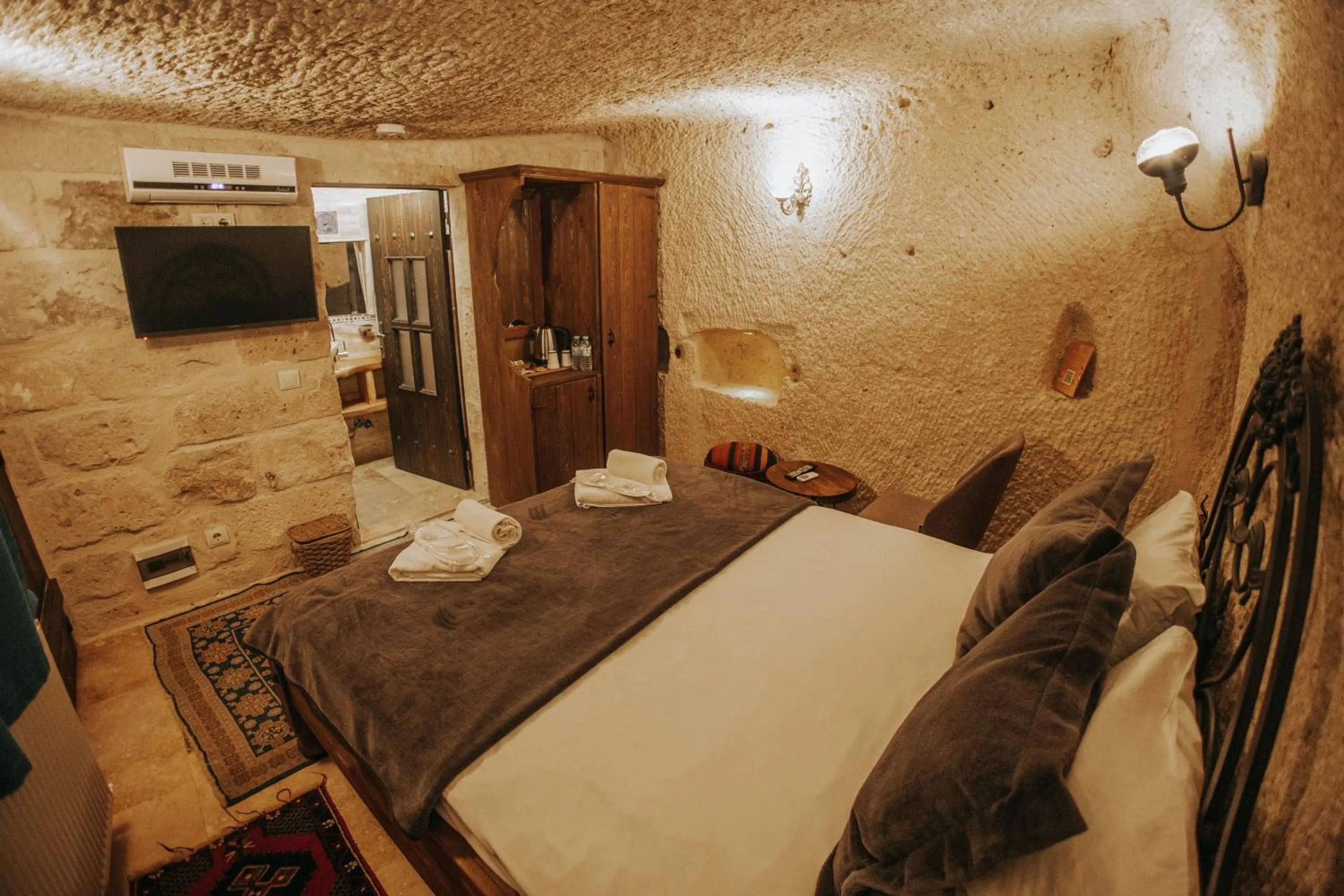 Bed in Vintage Cave House Hotel