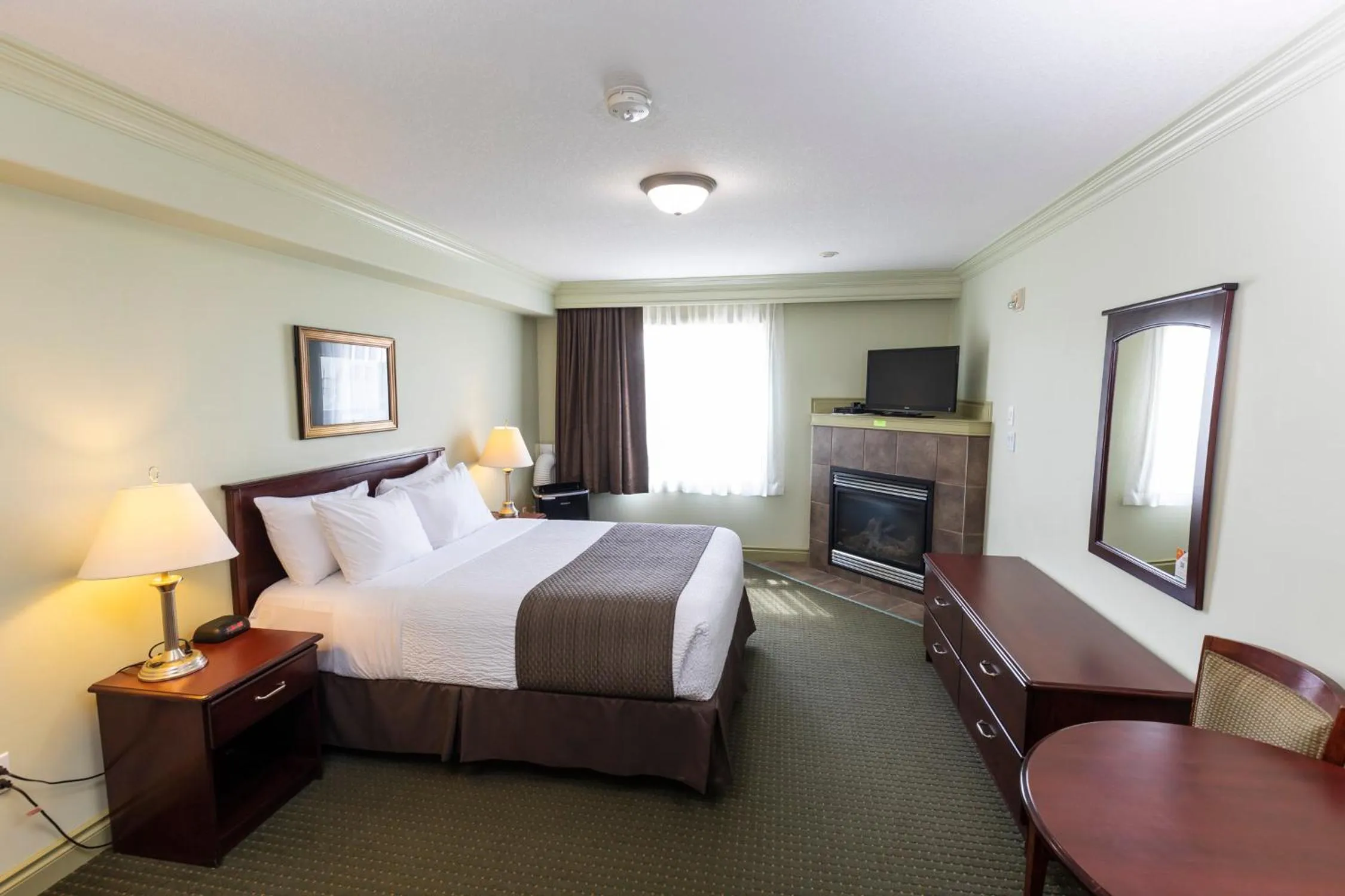 Bed in Quality Inn & Suites