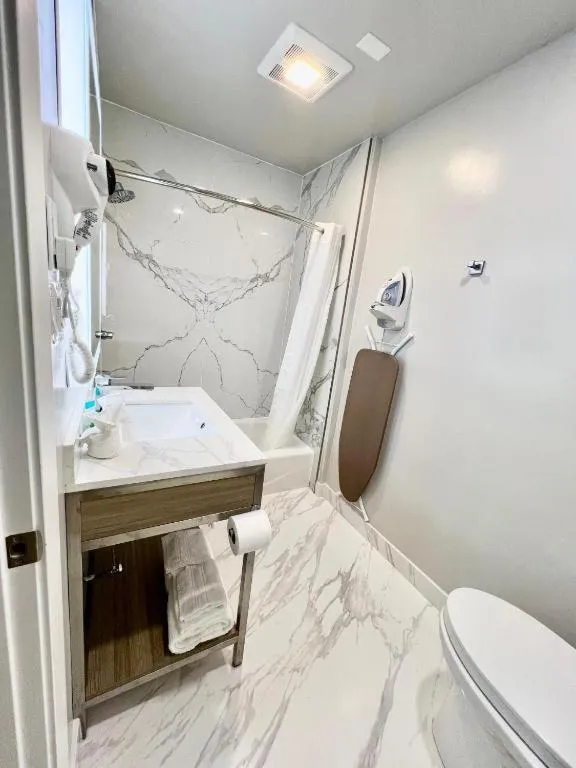 Toilet in Nob Hill Motor Inn -Newly Updated Rooms!