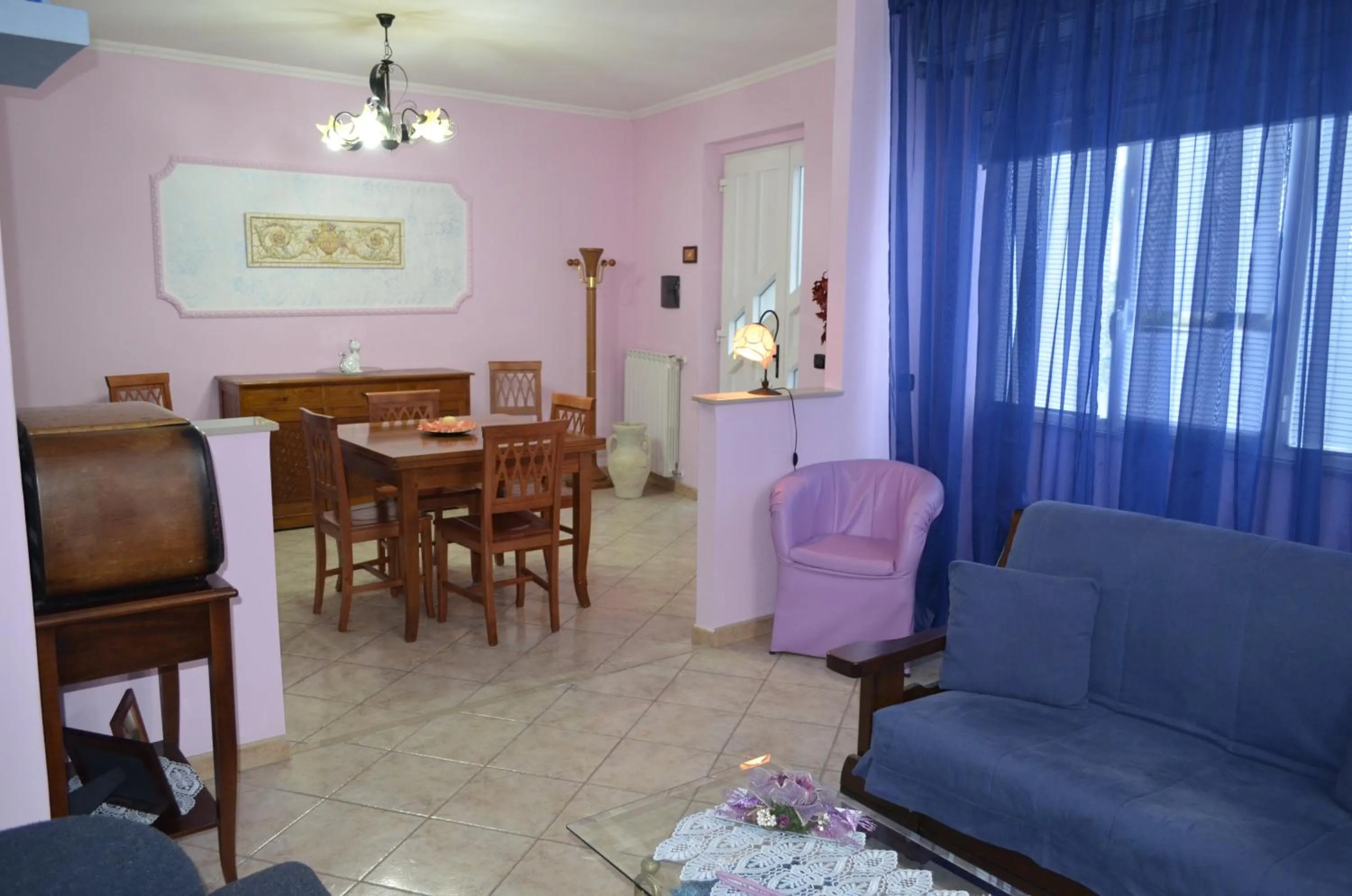 Communal lounge/ TV room in B&B Le Colonne