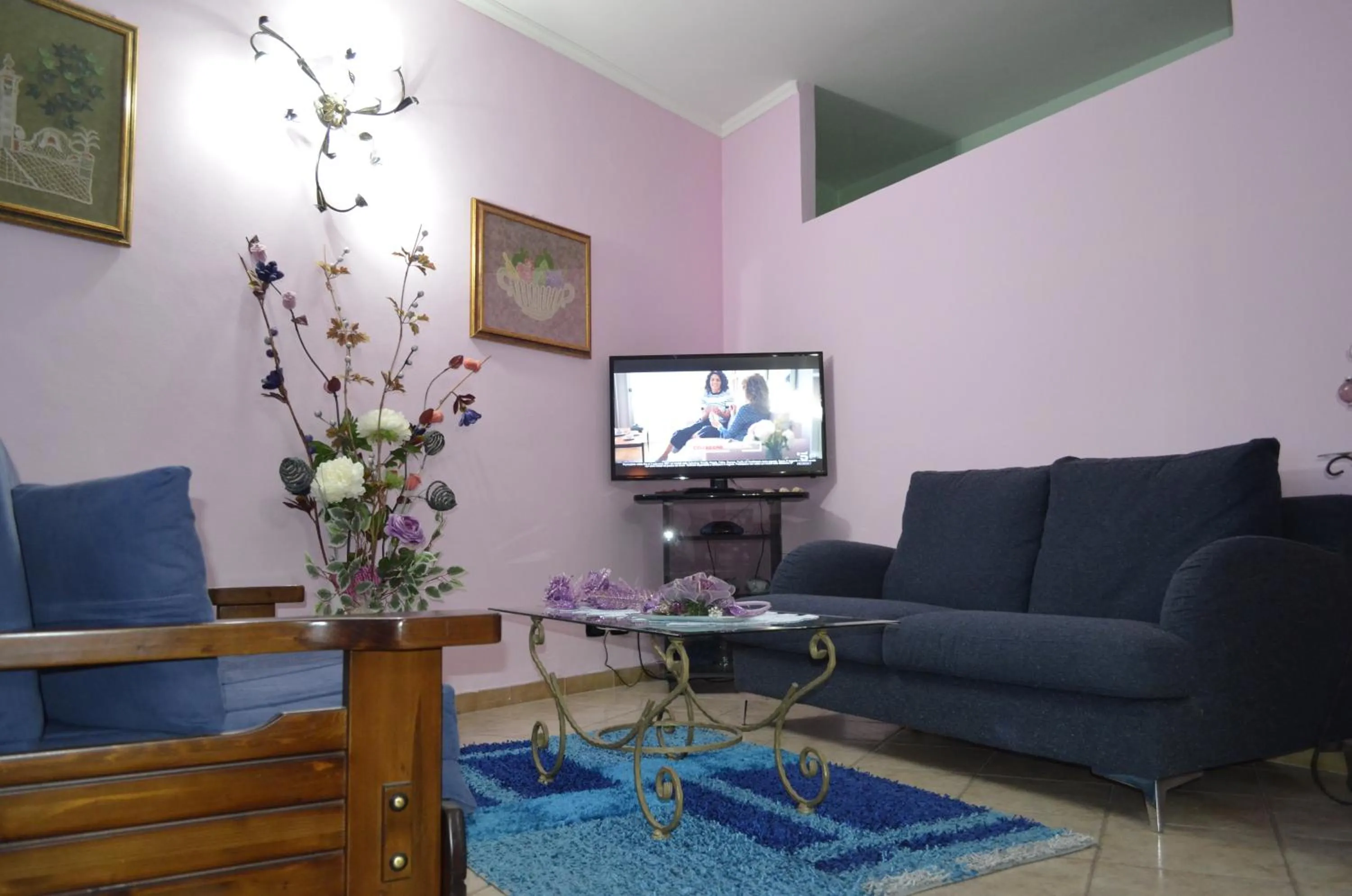 Communal lounge/ TV room in B&B Le Colonne