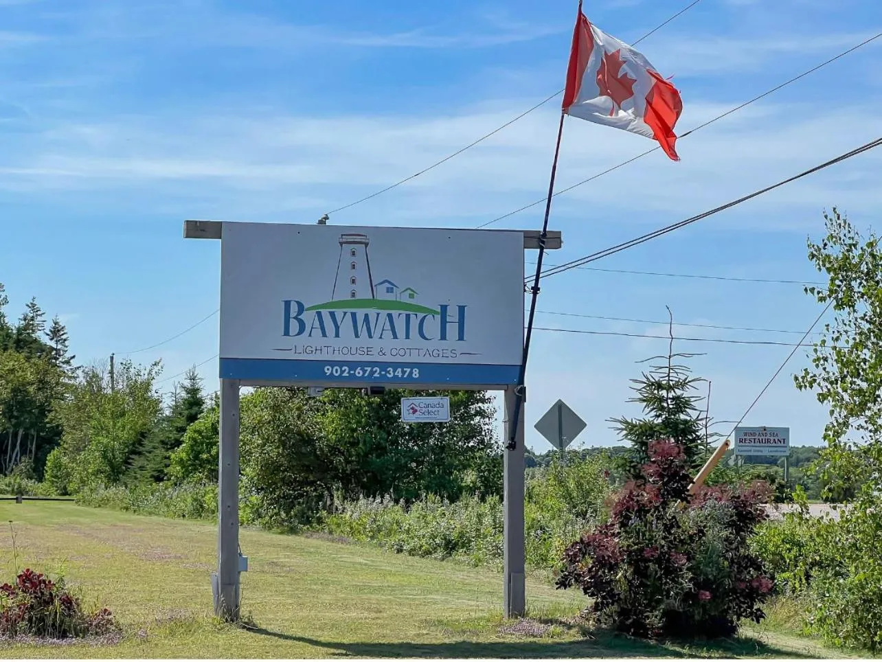 Property logo or sign in Baywatch Lighthouse Cottages & Motel