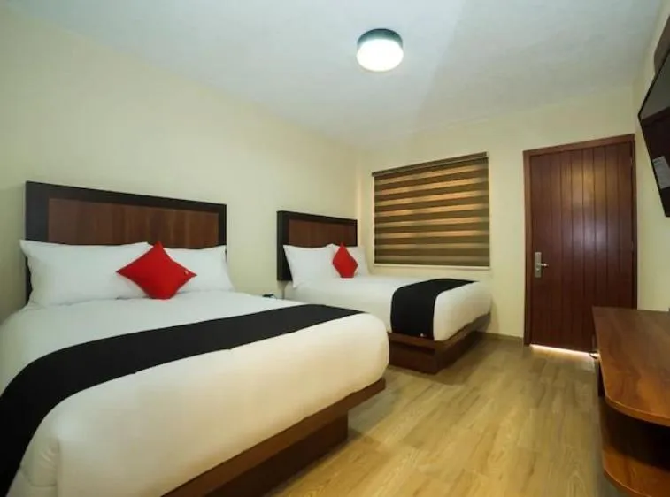 Bed in Hotel Colonial Acopinalco Inn