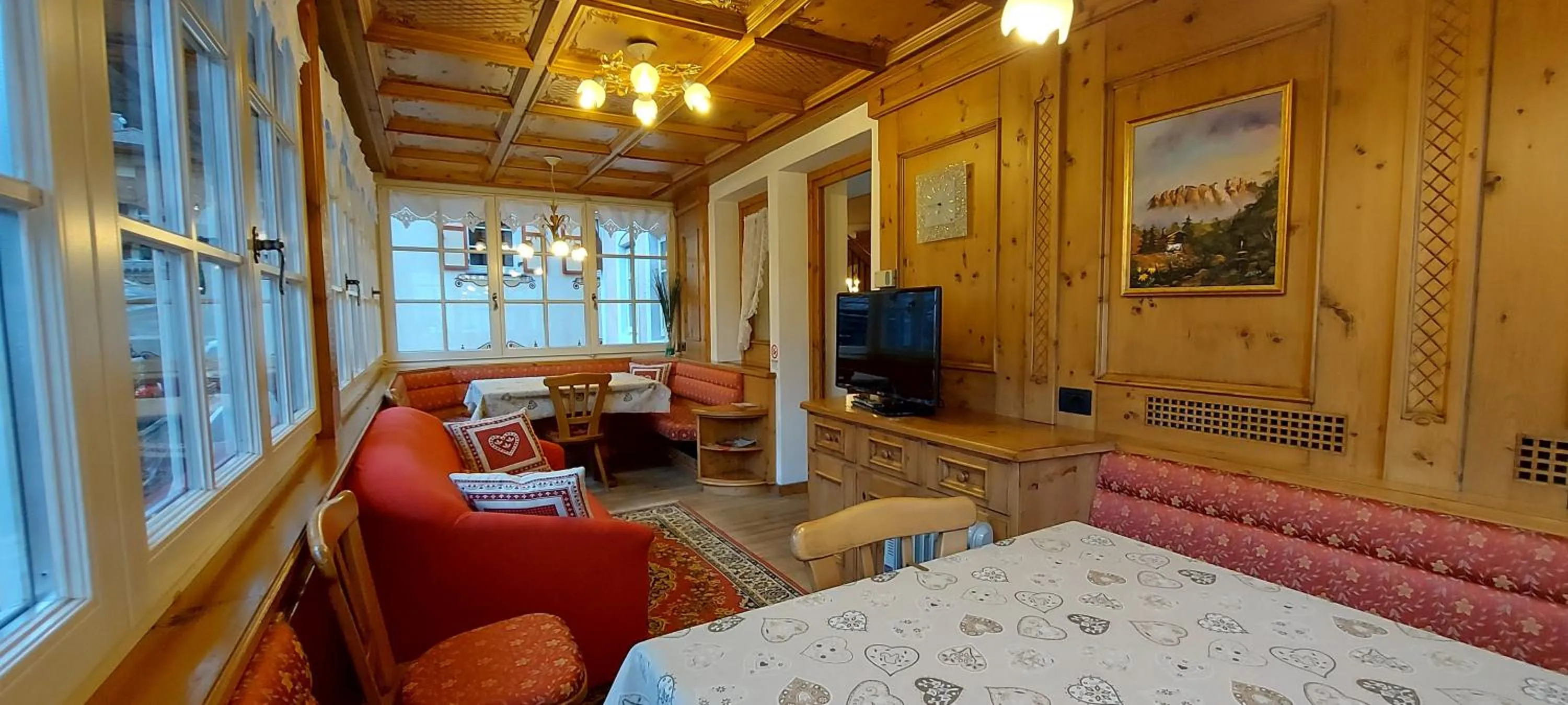 Communal lounge/ TV room, Bed in Garnì Stella Alpina