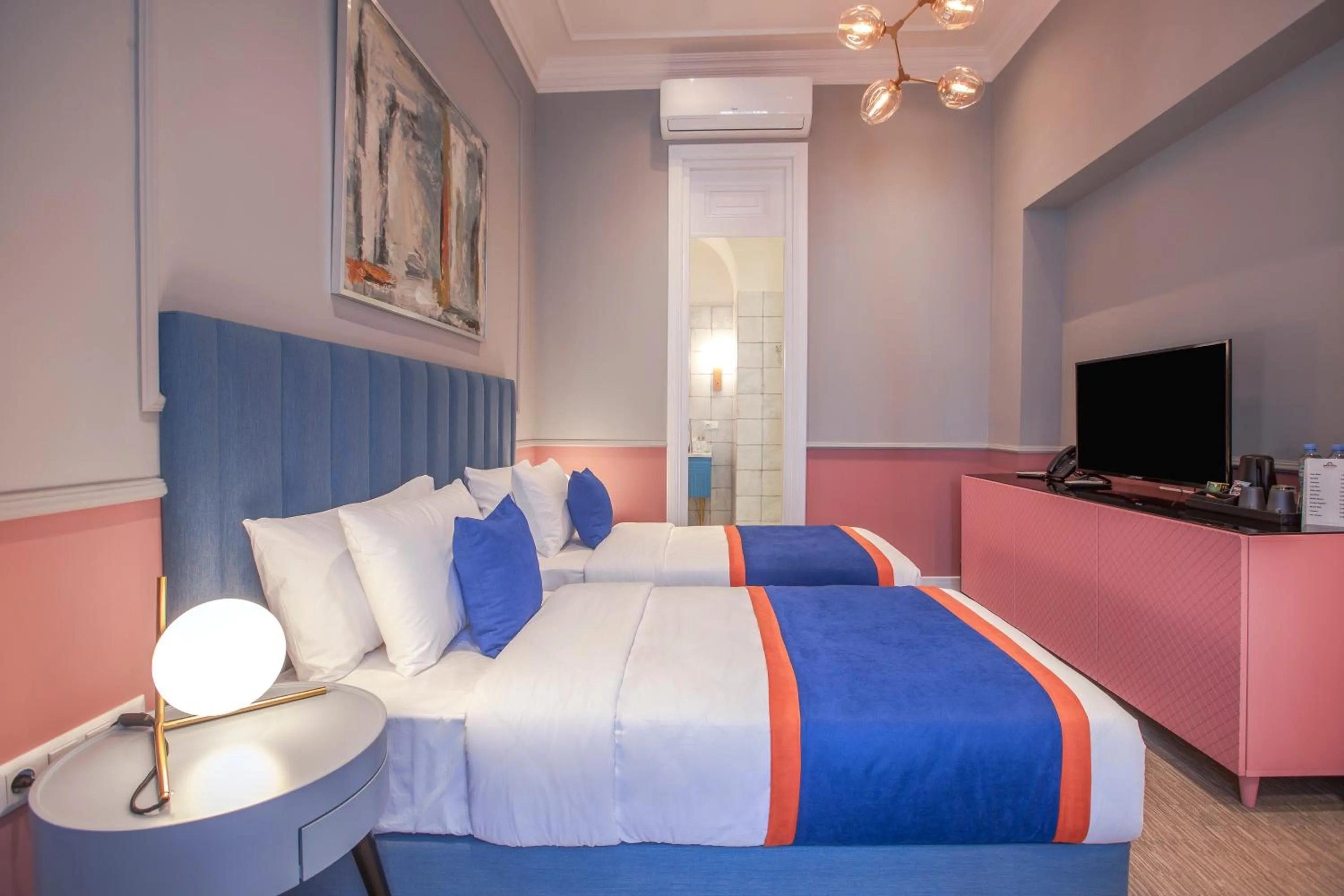 Bed in Heritage Hotel and Suites