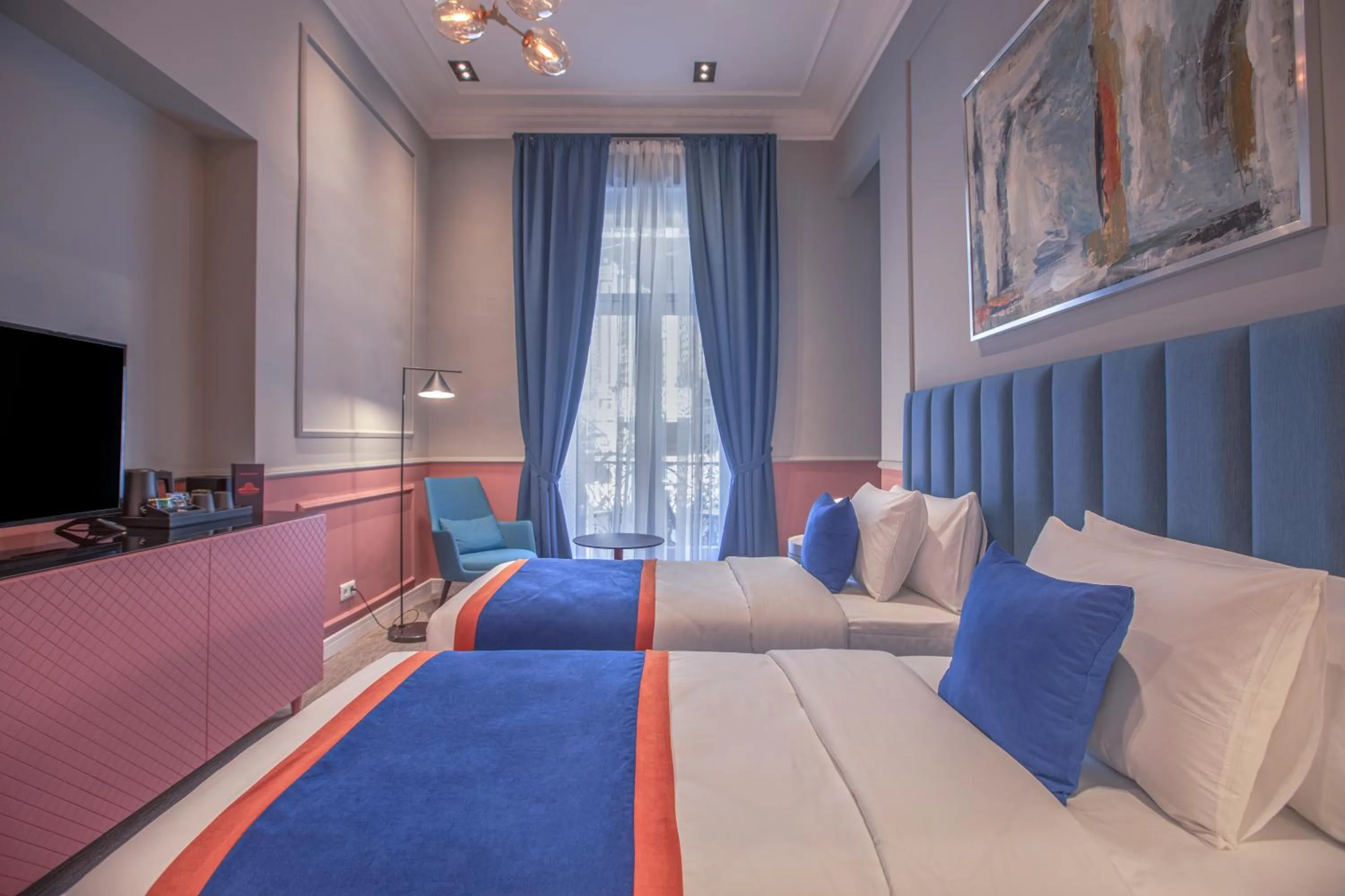 Bed in Heritage Hotel and Suites