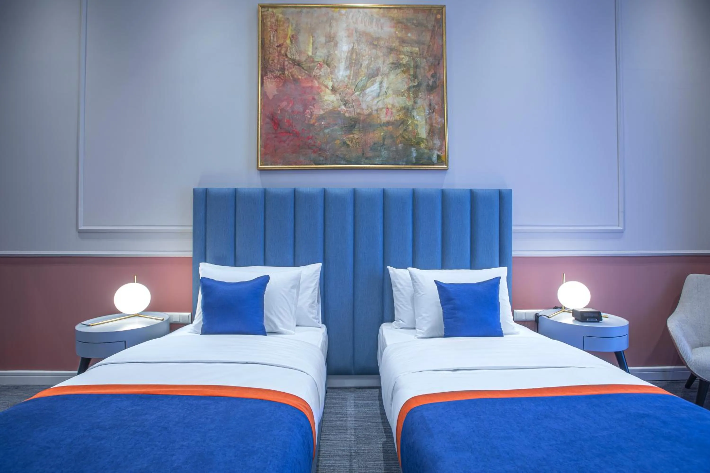 Bed in Heritage Hotel and Suites