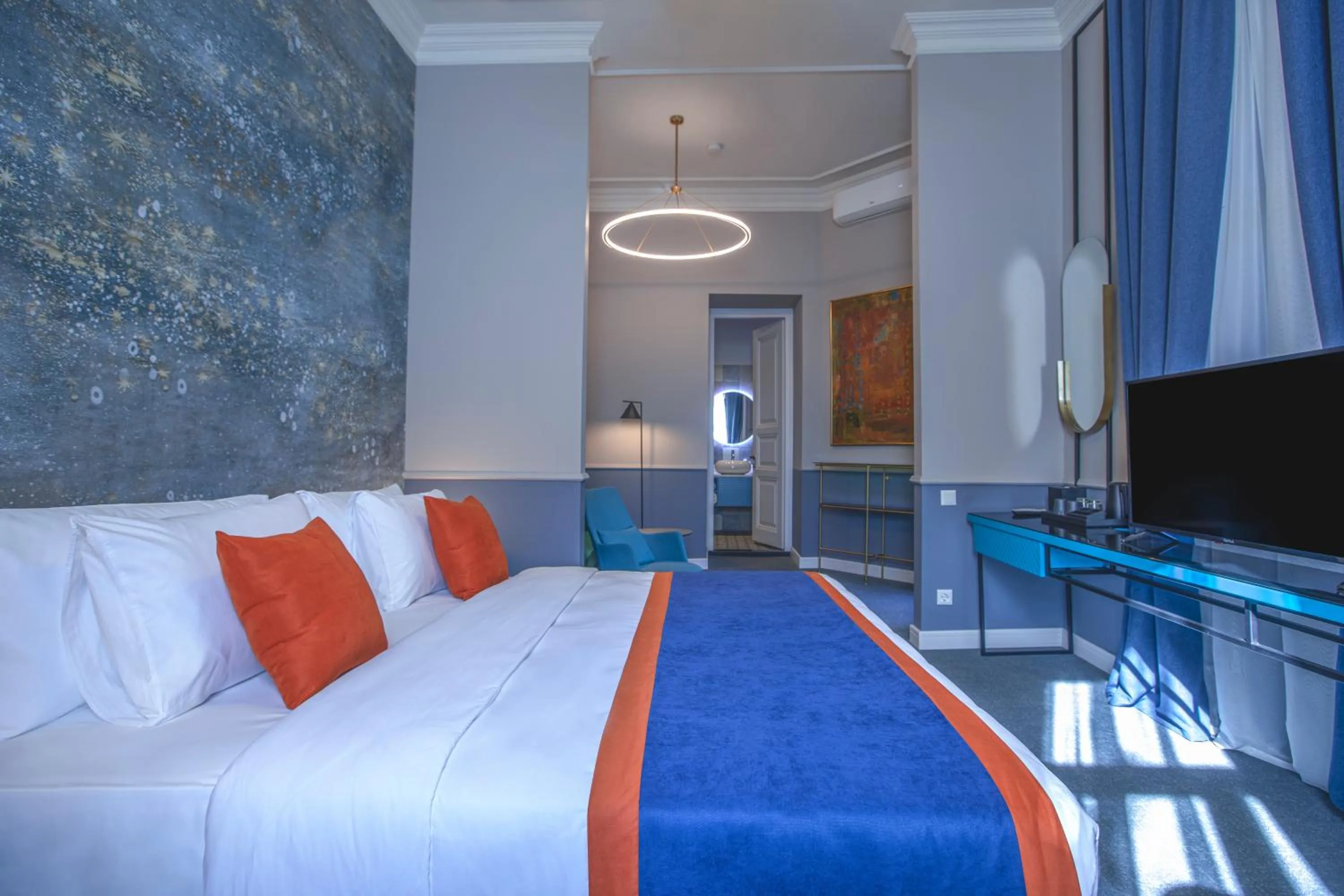 Bed in Heritage Hotel and Suites