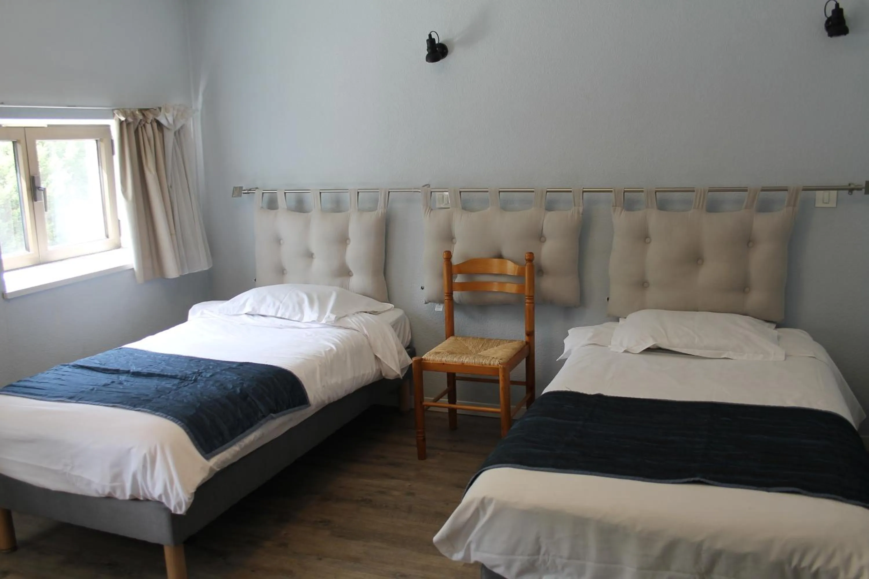 Bed in Logis Hôtel Le Saint Clément