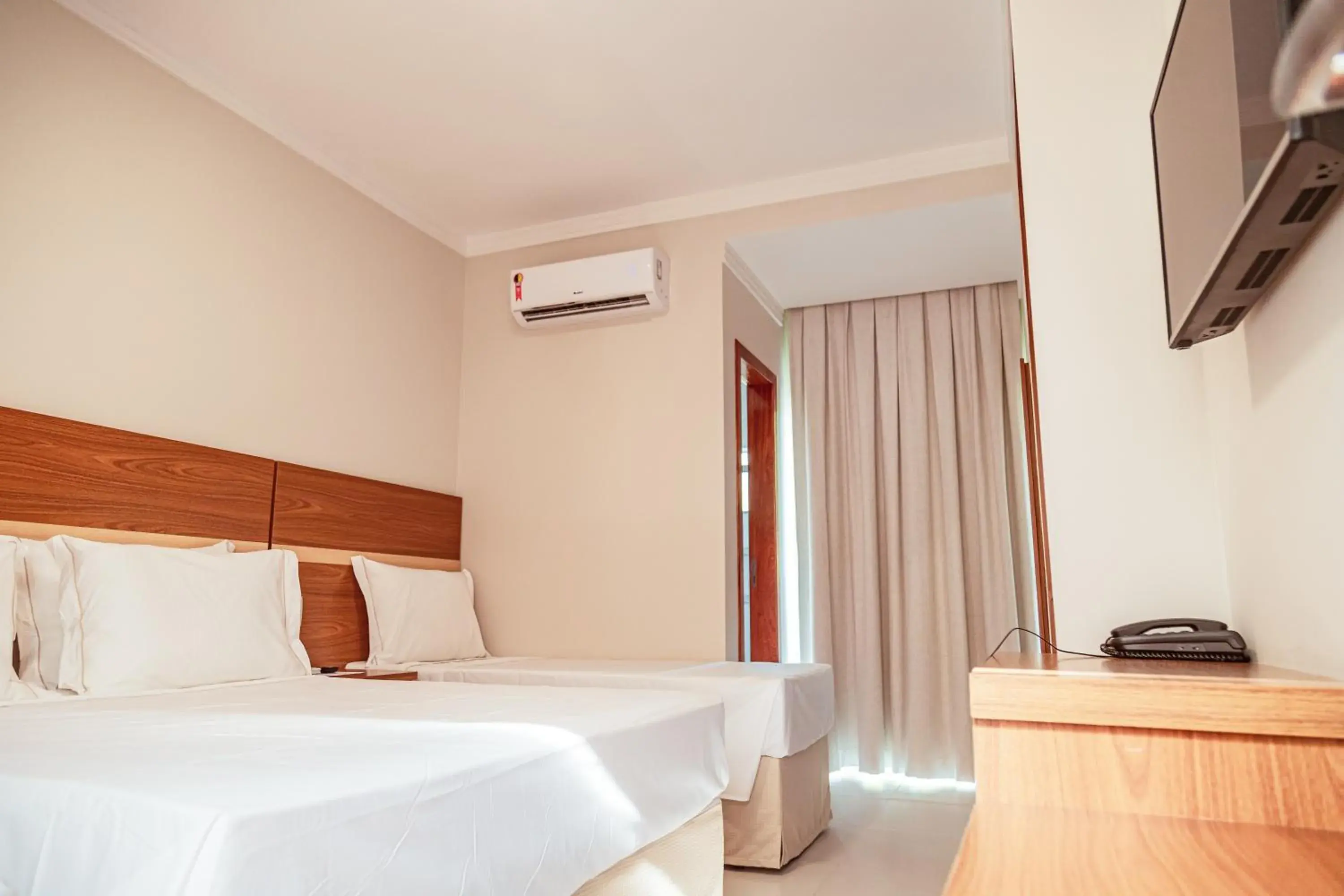 Bed in Orquídeas Praia Hotel Bed in Orquídeas Praia Hotel