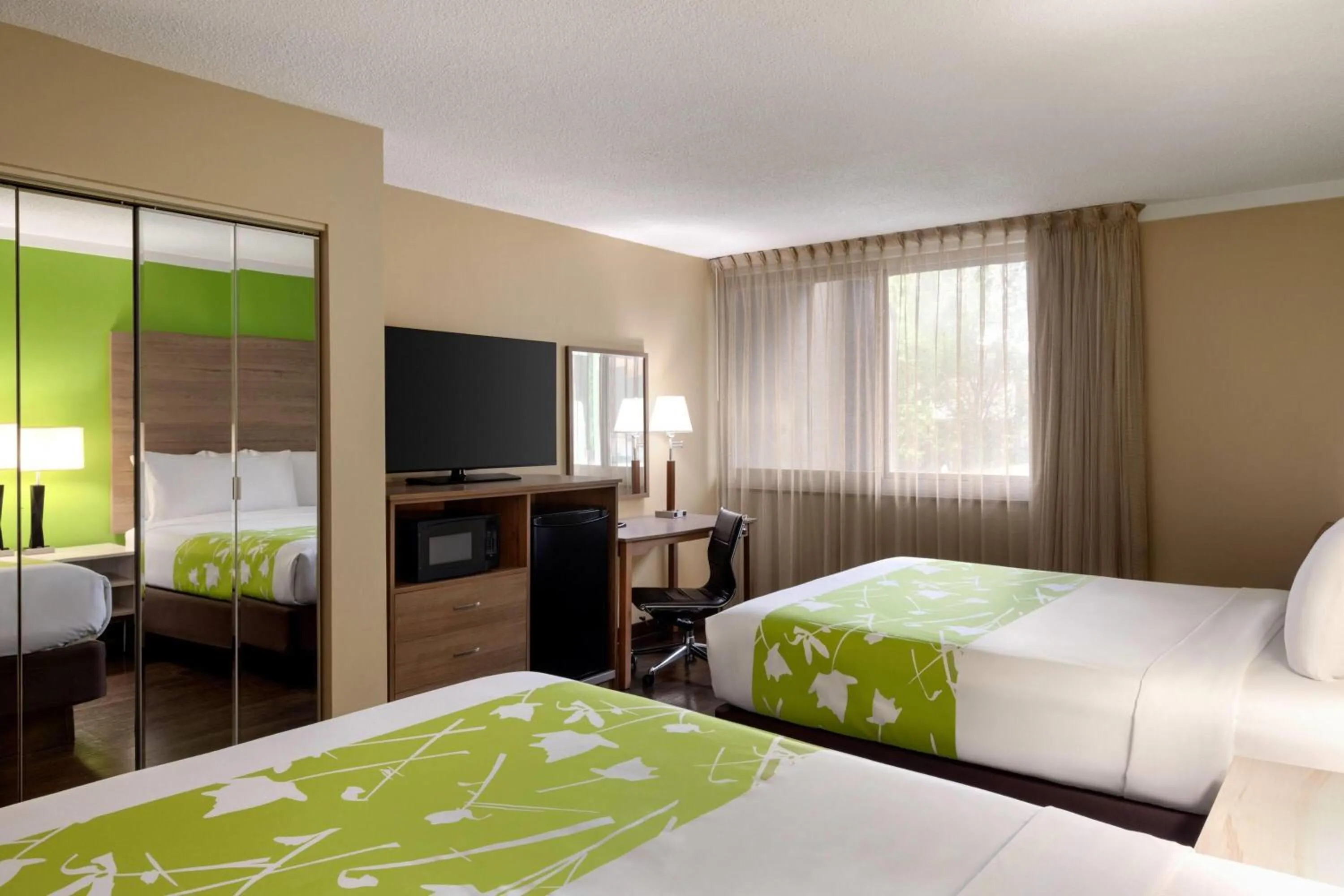 Photo of the whole room, Bed in Wyndham Garden Washington DC North