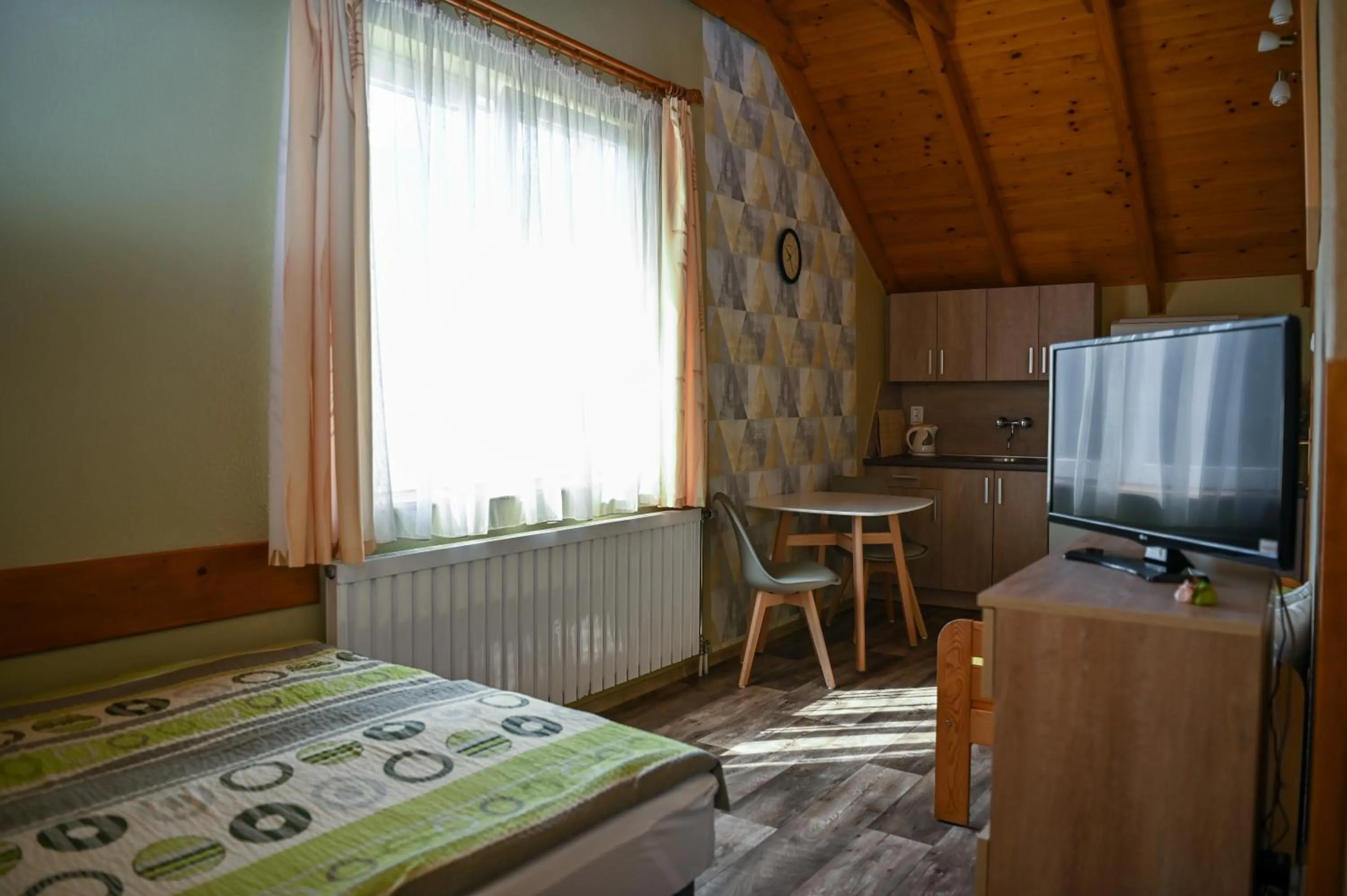 Photo of the whole room, Bed in Angéla Vendegház