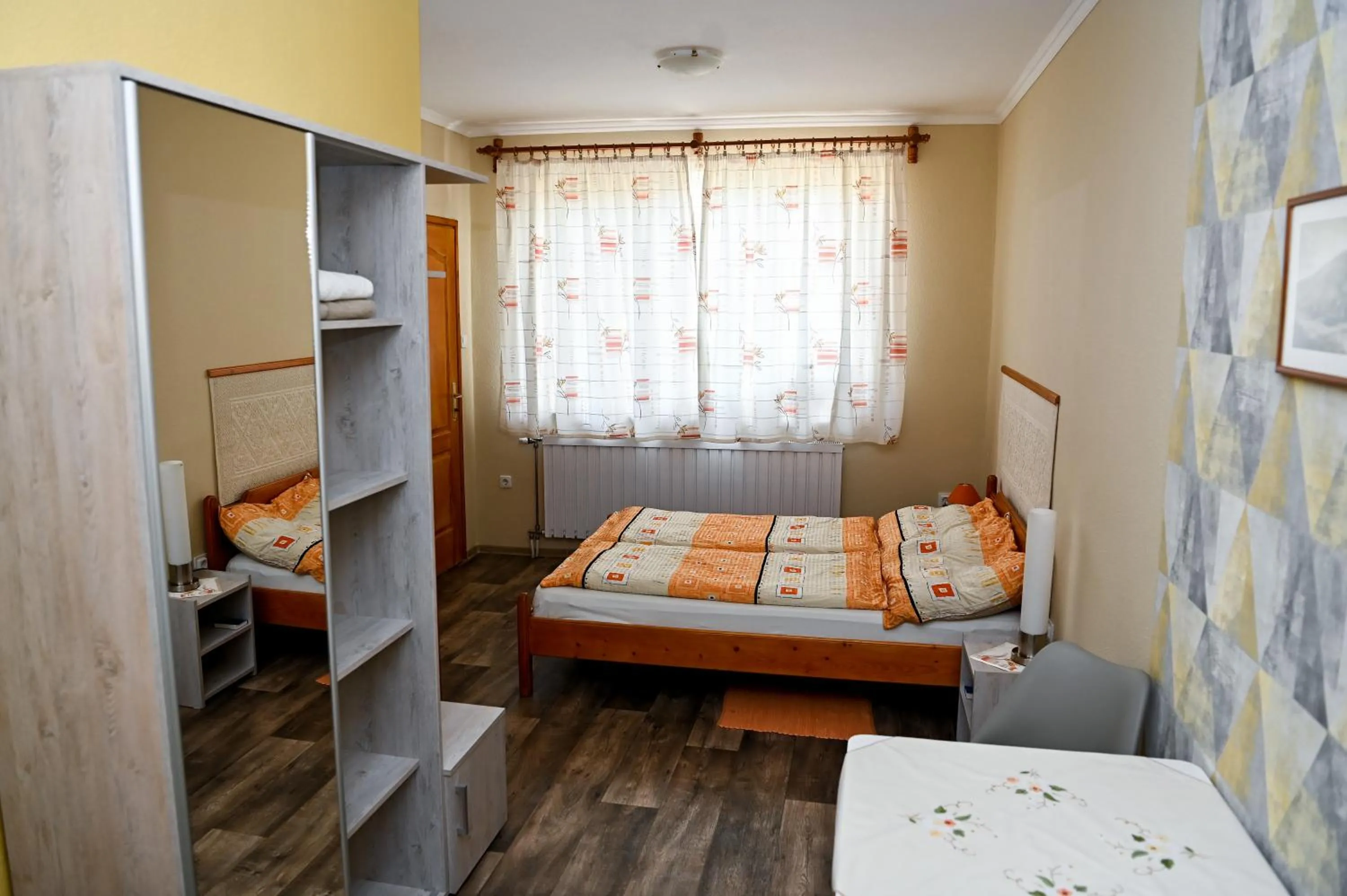 Photo of the whole room, Bed in Angéla Vendegház