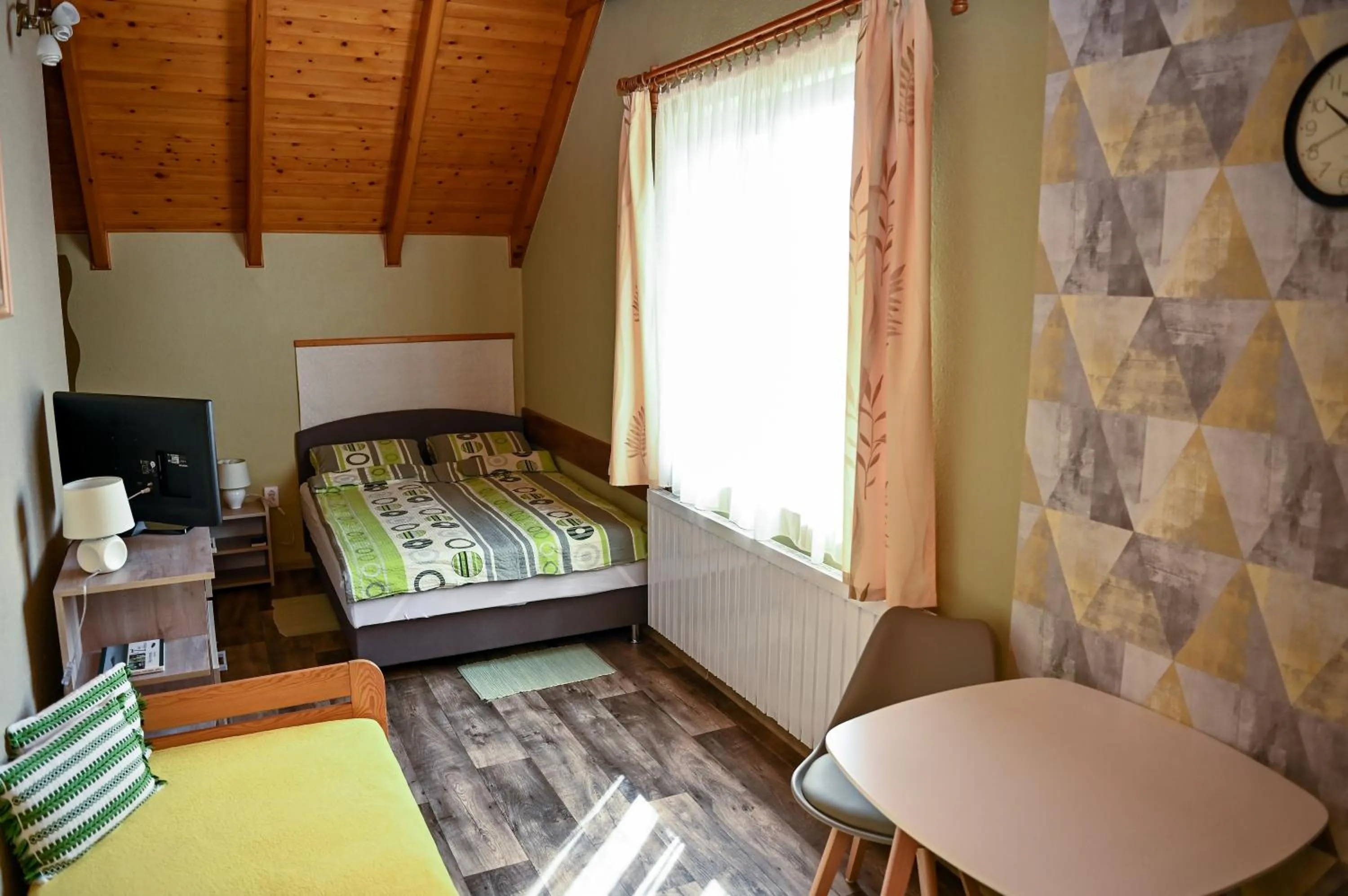 Photo of the whole room, Bed in Angéla Vendegház
