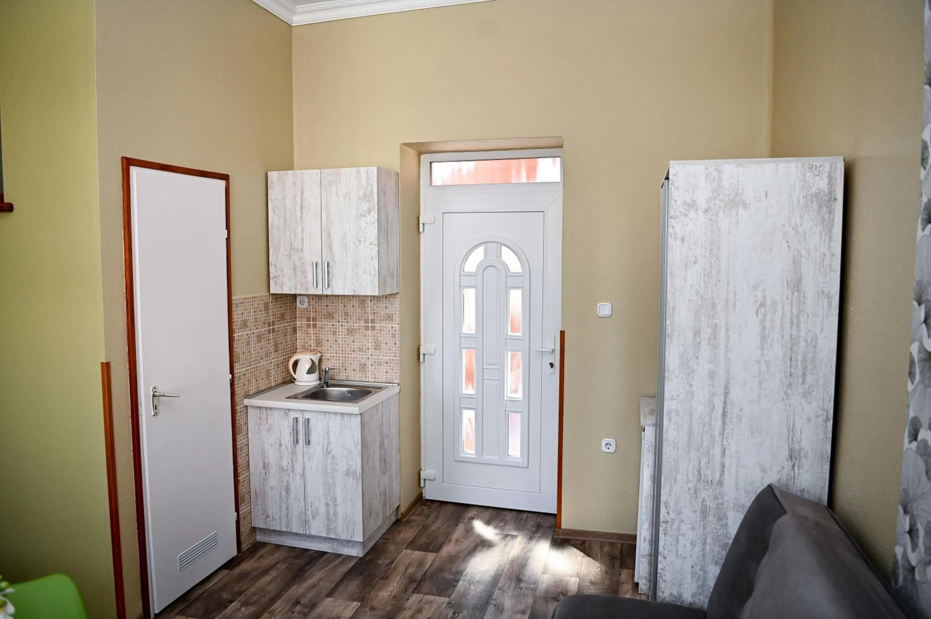 Kitchen or kitchenette in Angéla Vendegház
