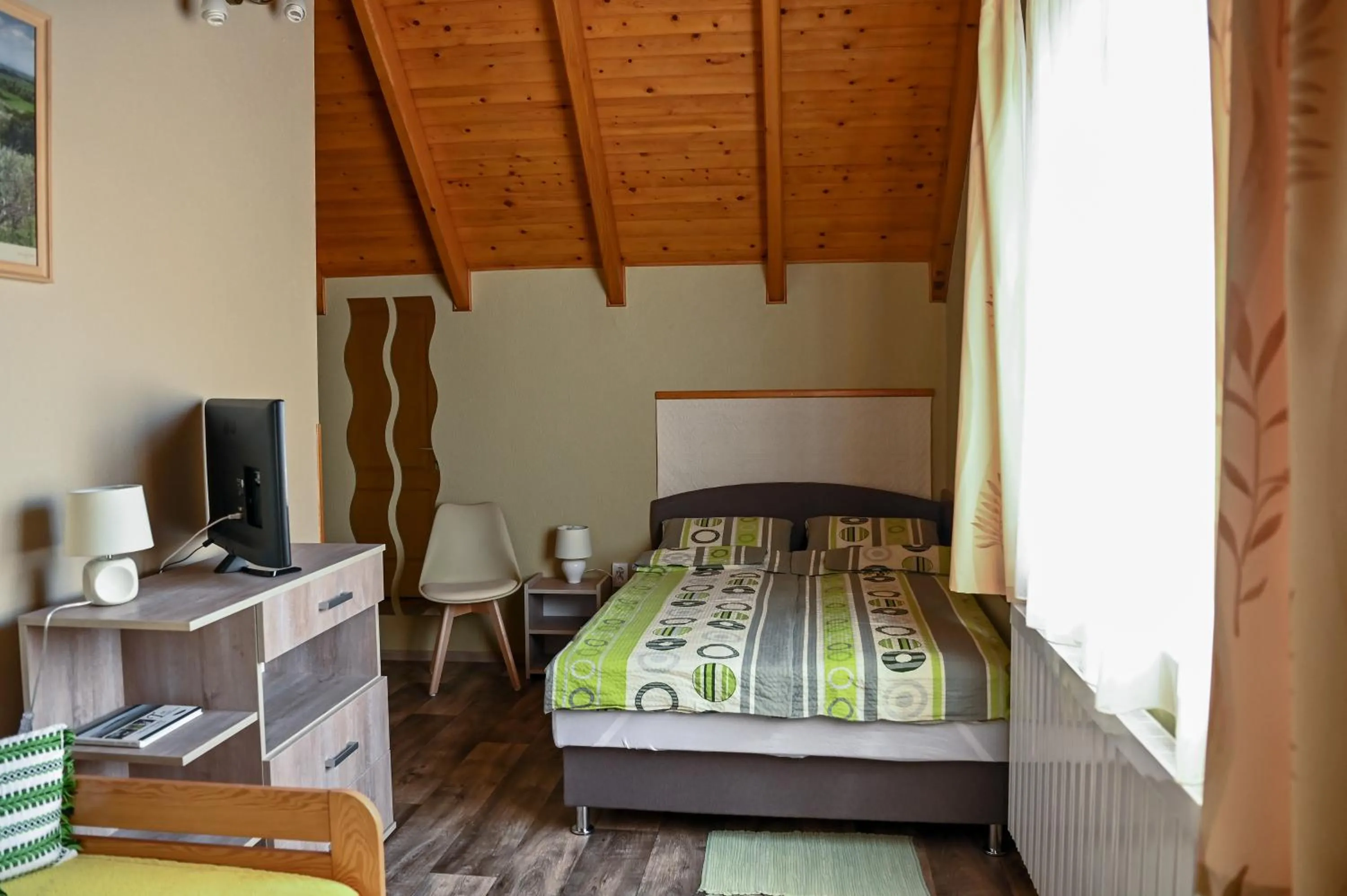 Photo of the whole room, Bed in Angéla Vendegház